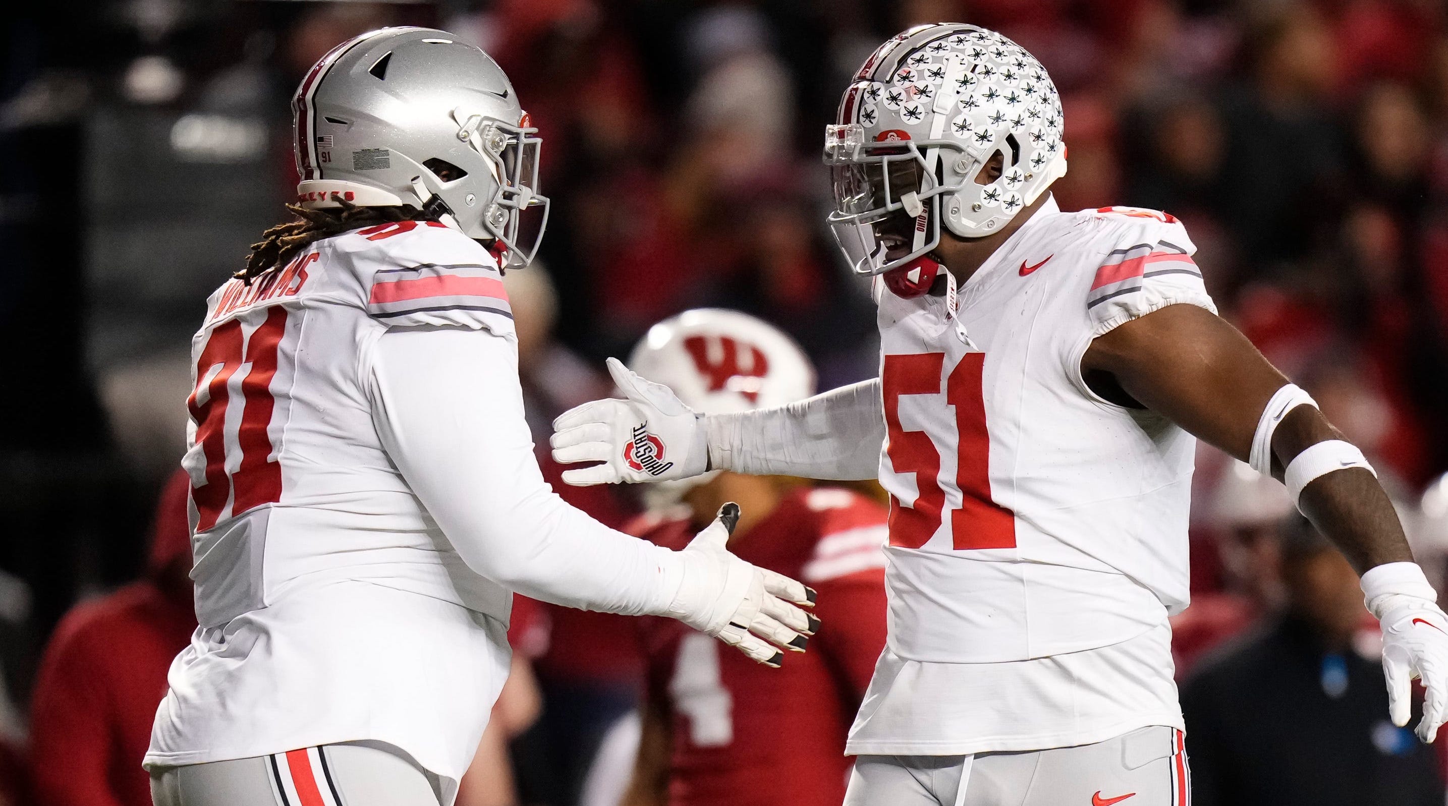 Ohio State defensive tackle Michael Hall Jr., right, celebrates with defensive tackle Tyleik Williams