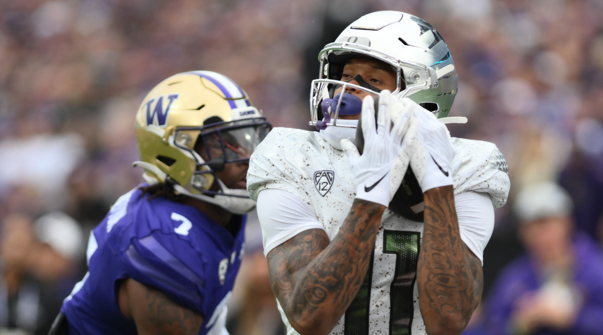 Oregon wide receiver Troy Franklin, right, catches a pass for a touchdown against Washington
