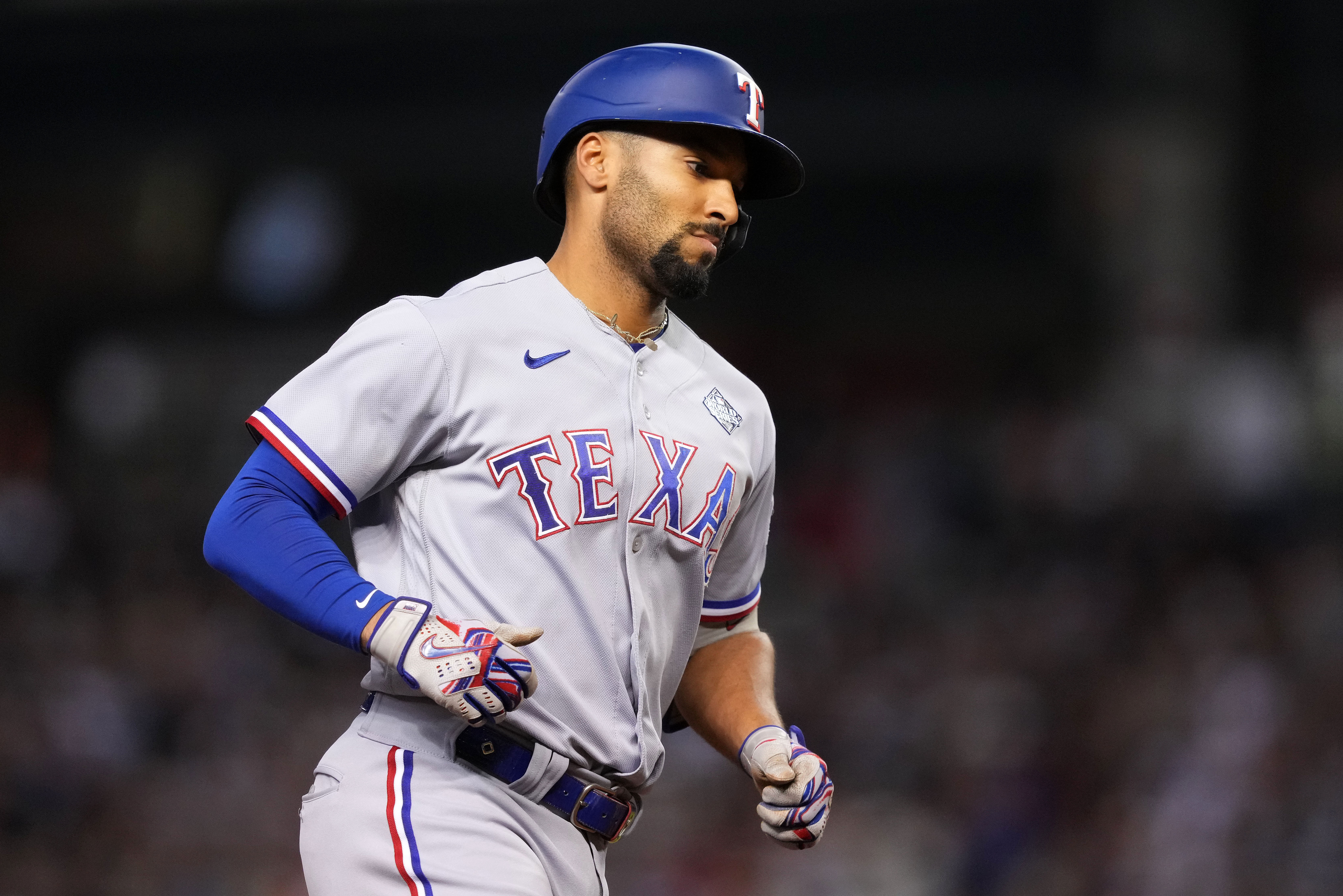 Oct 31, 2023; Phoenix, Arizona, USA; Texas Rangers second baseman Marcus Semien (2) reacts after hitting a three run home run against the Arizona Diamondbacks during the third inning in game four of the 2023 World Series at Chase Field. Mandatory Credit: Joe Camporeale-USA TODAY Sports