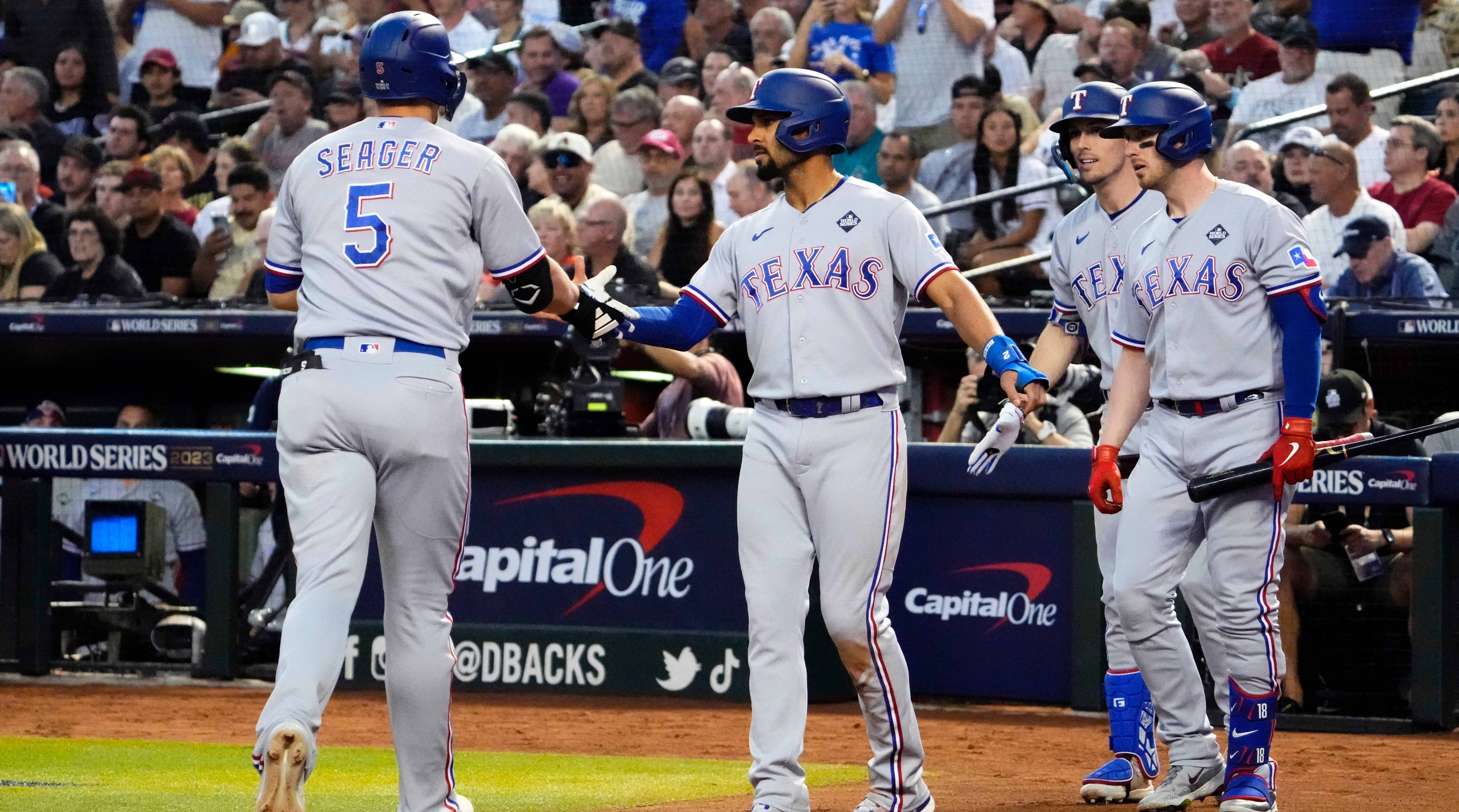 Corey Seager congratulating Marcus Semien.