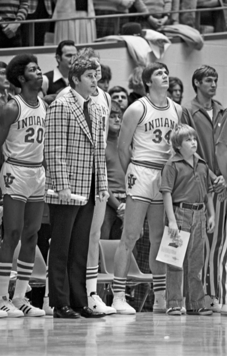 Bob Knight and the 1974 Hoosiers stand along the sidelines for the National Anthem.