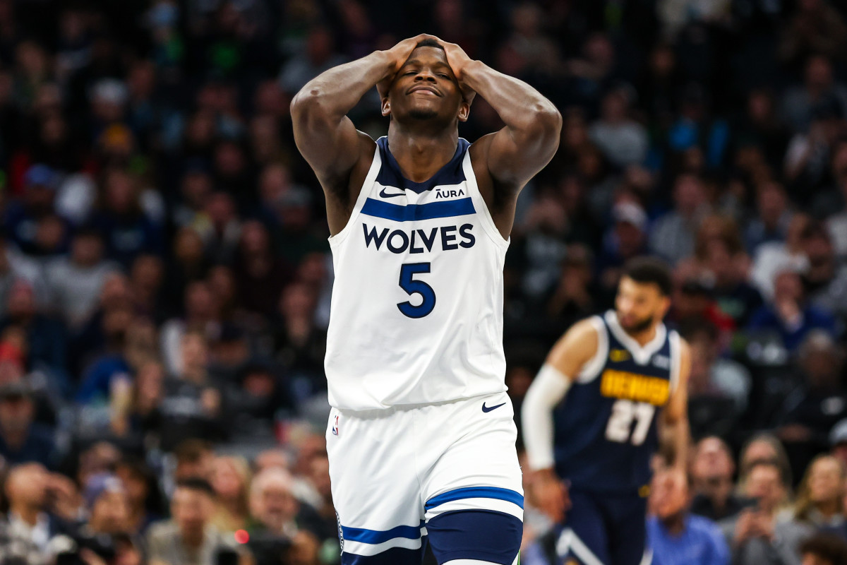 Nov 1, 2023; Minneapolis, Minnesota, USA; Minnesota Timberwolves guard Anthony Edwards (5) reacts to a shot against the Denver Nuggets during the first half at Target Center.