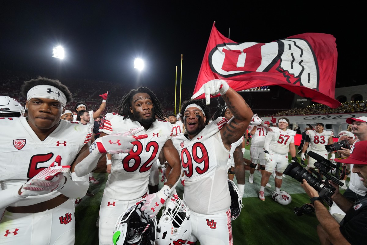 Oct 21, 2023; Los Angeles, California, USA; Utah Utes receiver Landen King (82) and defensive tackle Tevita Fotu (99) celebrate after the game against the Southern California Trojans at United Airlines Field at Los Angeles Memorial Coliseum.