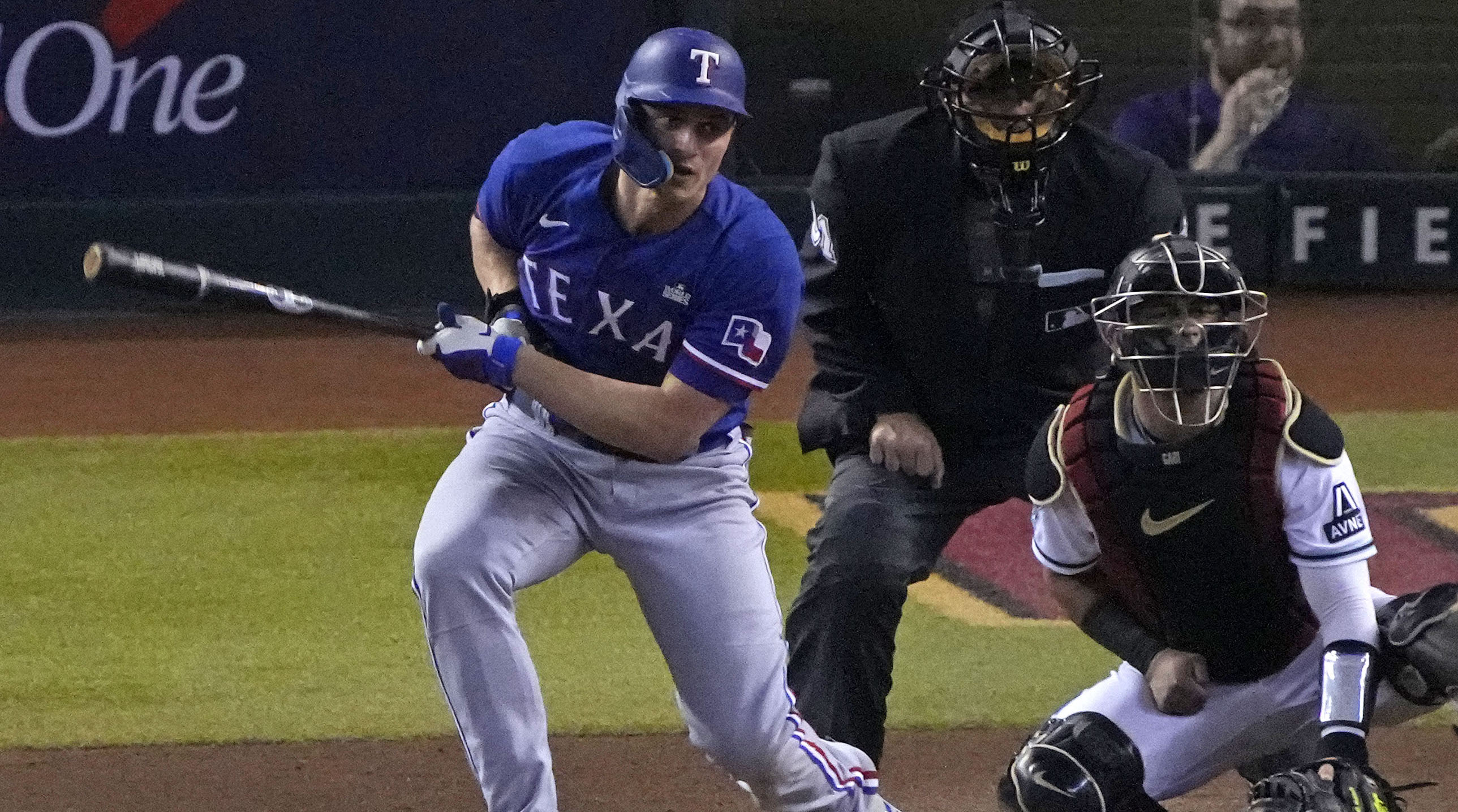 Rangers shortstop Corey Seager hits a single against the Diamondbacks during Game 5 of the 2023 World Series