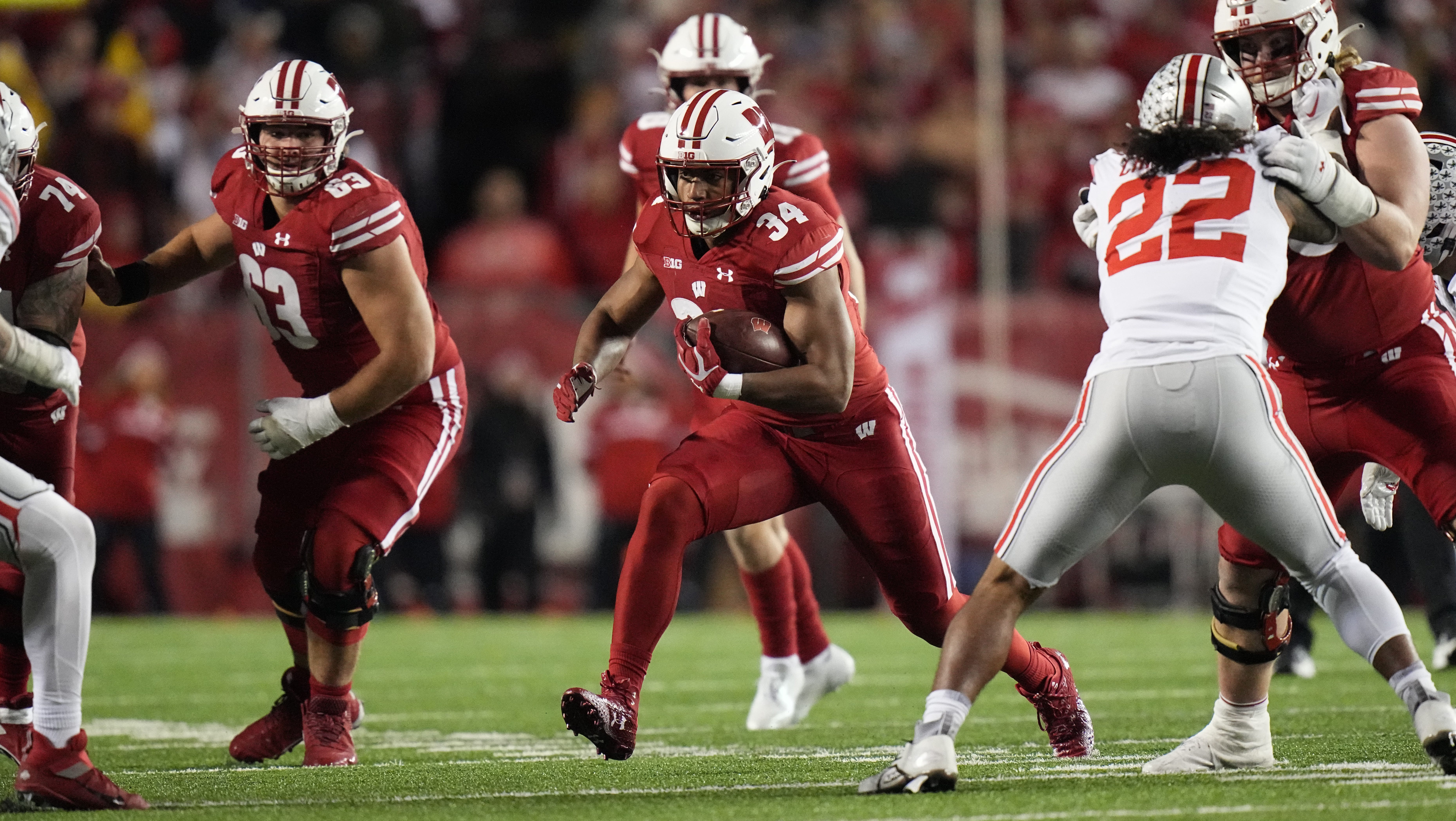 Wisconsin running back Jackson Acker (34) finds a seam in the Ohio State defense during the third quarter of their game Saturday, October 28, 2023 at Camp Randall Stadium in Madison, Wisconsin. Ohio State beat Wisconsin 24-10.