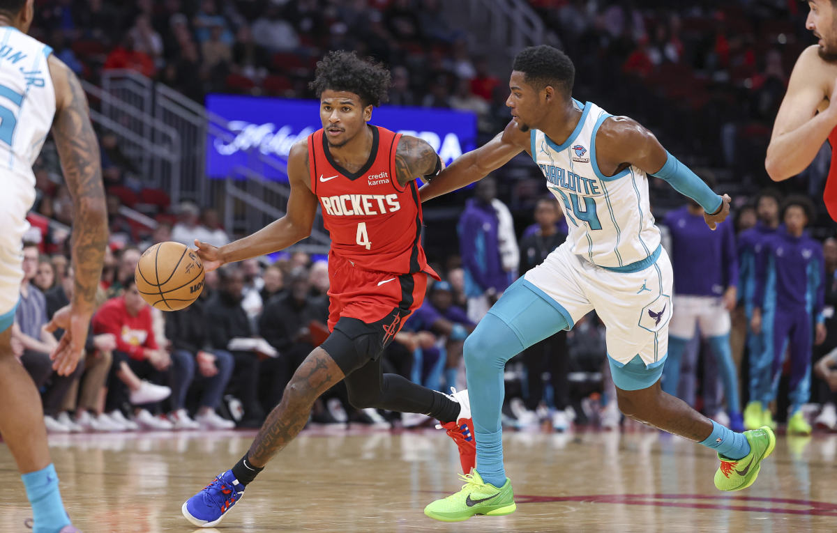 Houston Rockets guard Jalen Green drives past Charlotte Hornets forward Brandon Miller