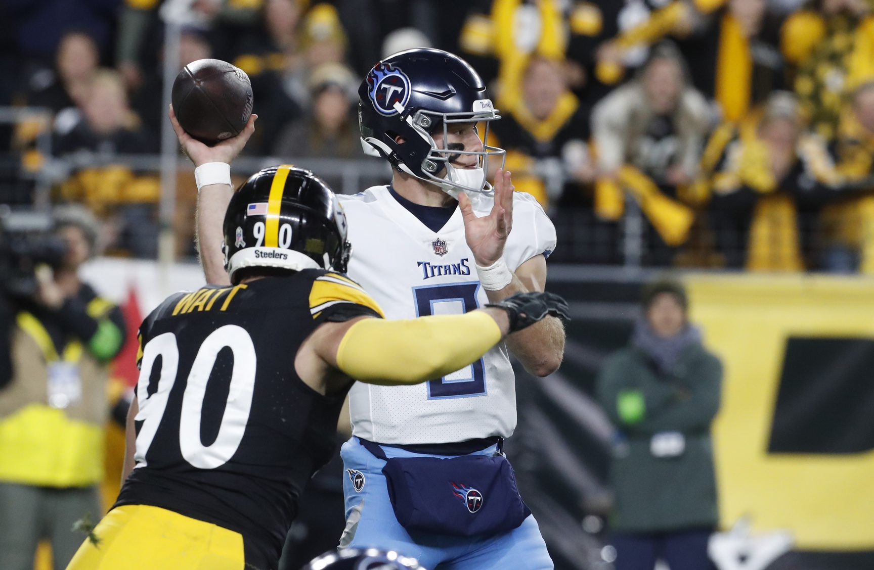 Tennessee Titans quarterback Will Levis (8) passes against pressure from Pittsburgh Steelers linebacker T.J. Watt (90) during the first quarter at Acrisure Stadium.
