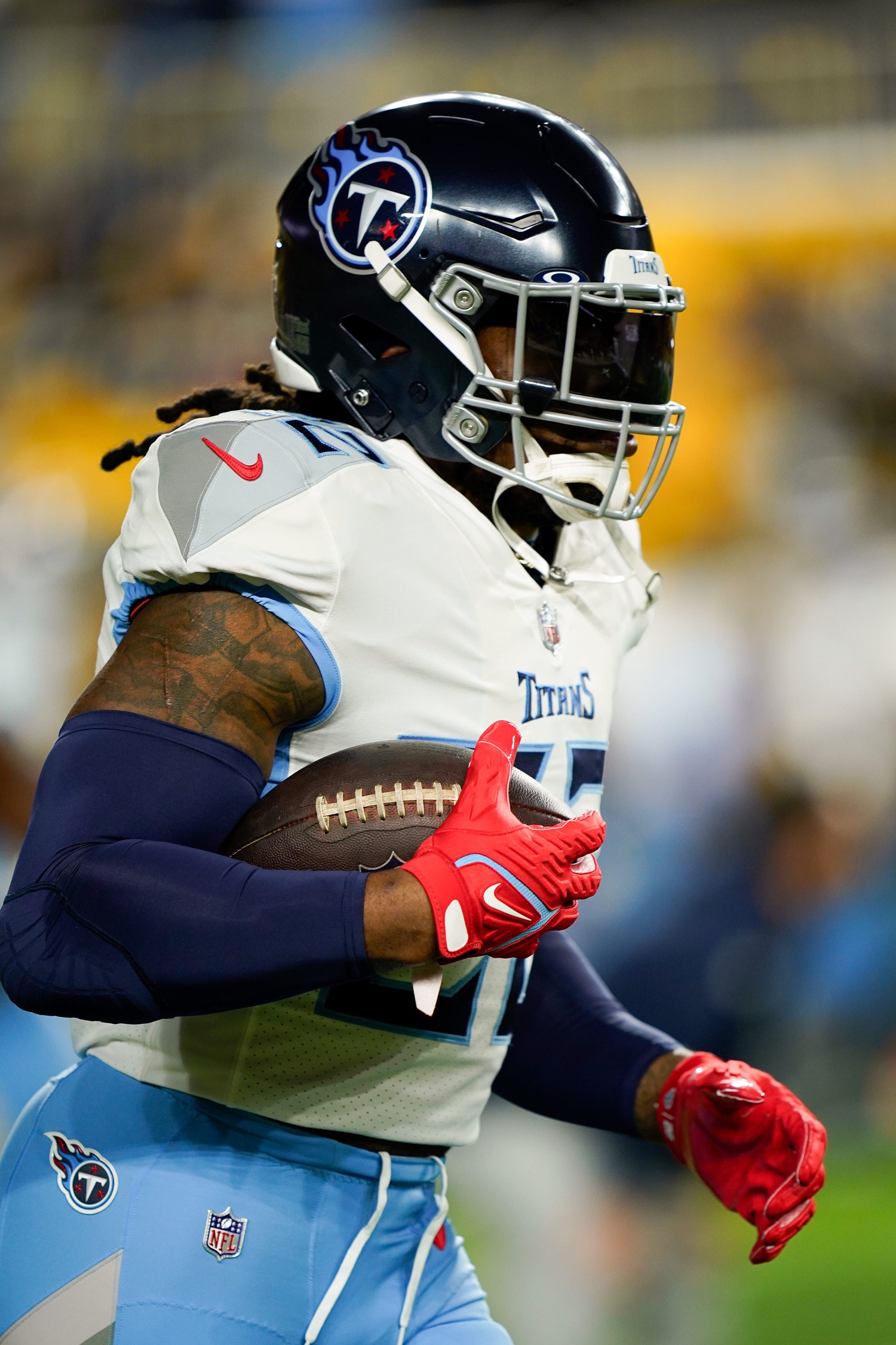 Tennessee Titans running back Derrick Henry (22) runs drills before a game against the Pittsburgh Steelers. 