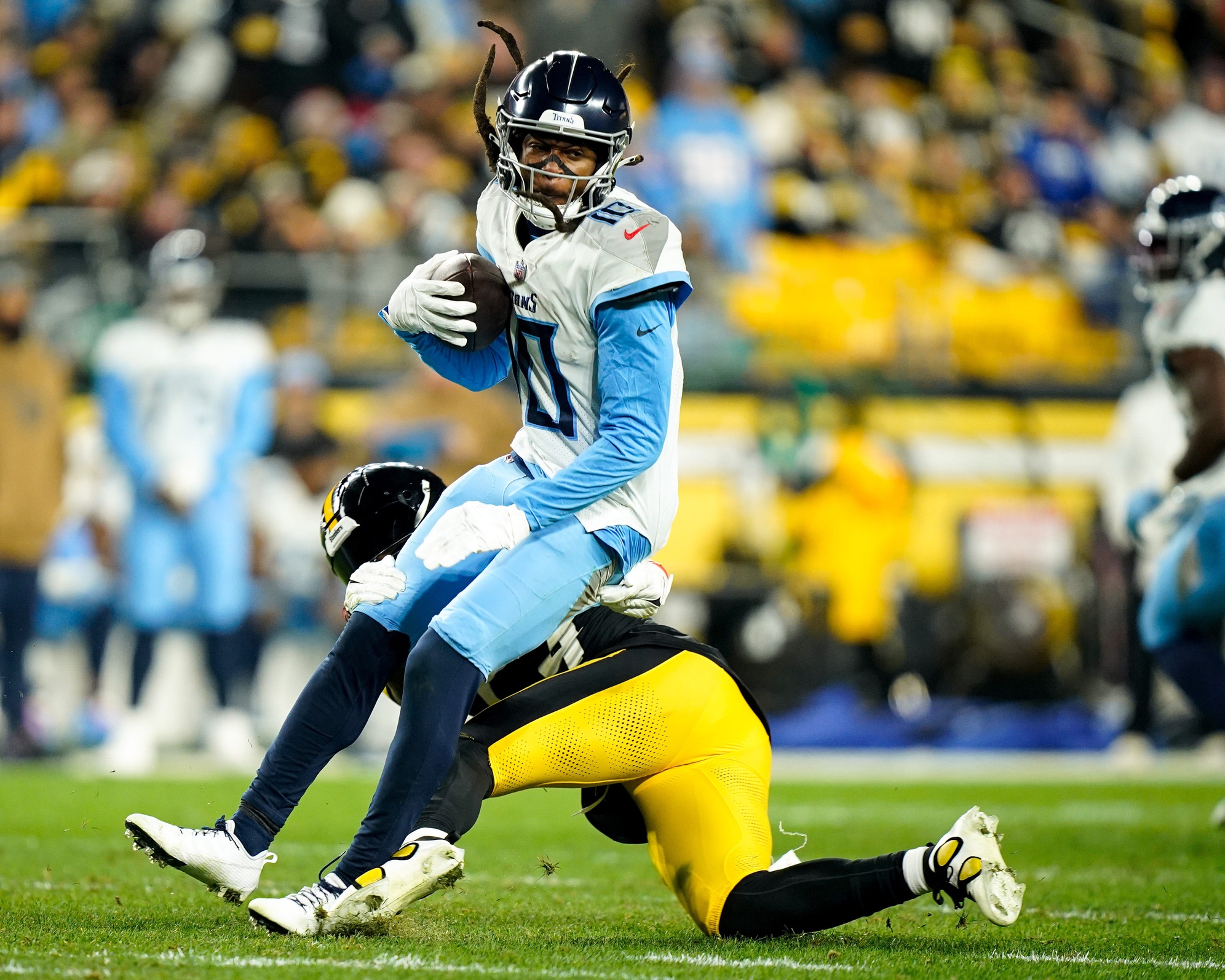 Tennessee Titans wide receiver DeAndre Hopkins (10) is pulled down by Pittsburgh Steelers linebacker Kwon Alexander (54).