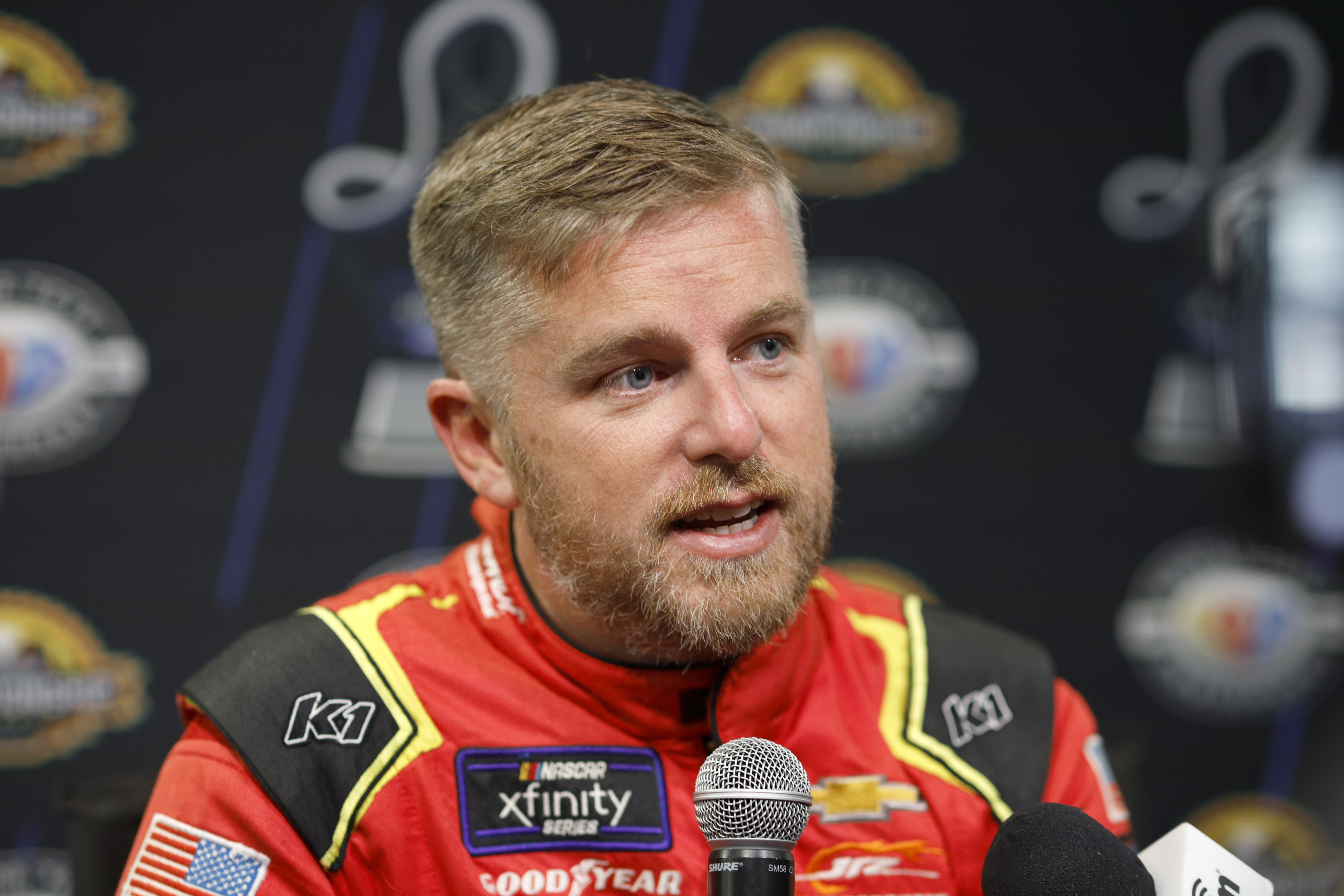 Justin Allgaier speaks to the media during Thursday's NASCAR Championship Media Day at Phoenix Raceway. (Photo by Sean Gardner/Getty Images)