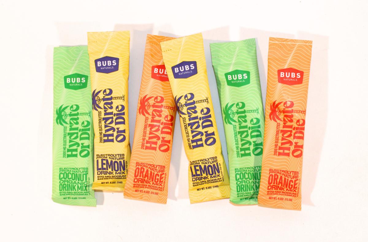 BUBS Naturals electrolyte travel packs in various flavors against a white background