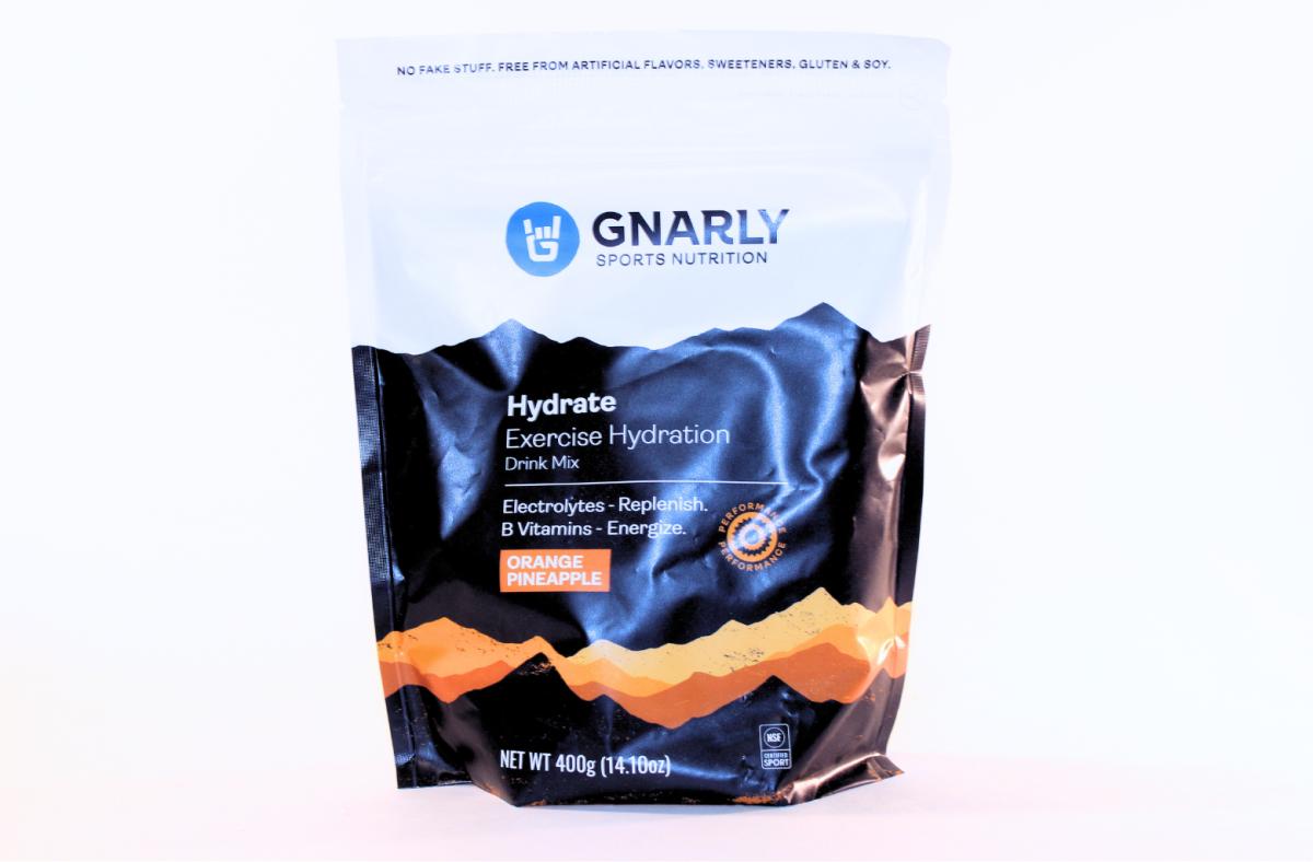 A bag of Gnarly Sports Nutrition Hydrate Exercise Hydration Drink Mix in Orange Pineapple flavor against a white background