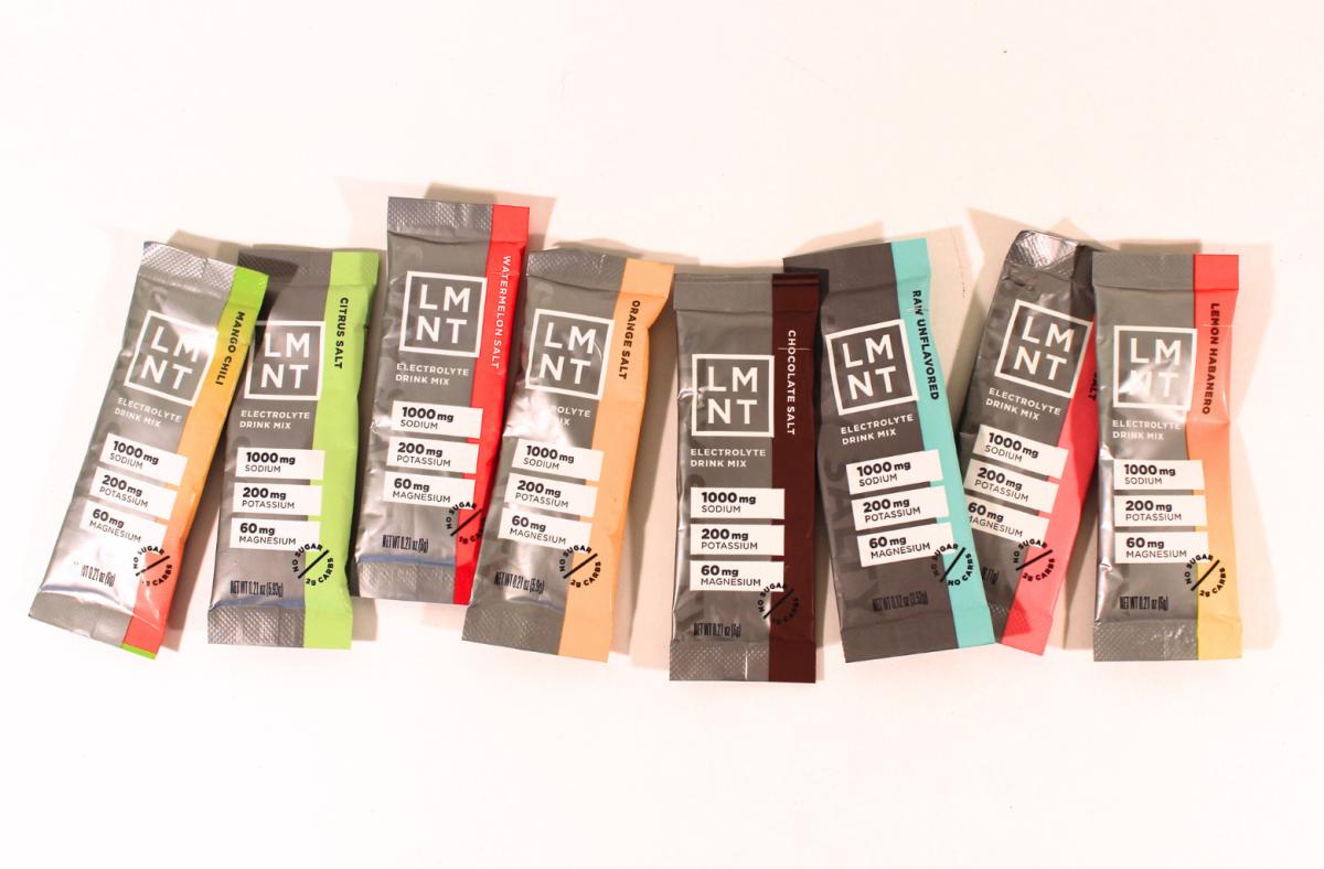LMNT electrolyte travel packets in various flavors against a white background