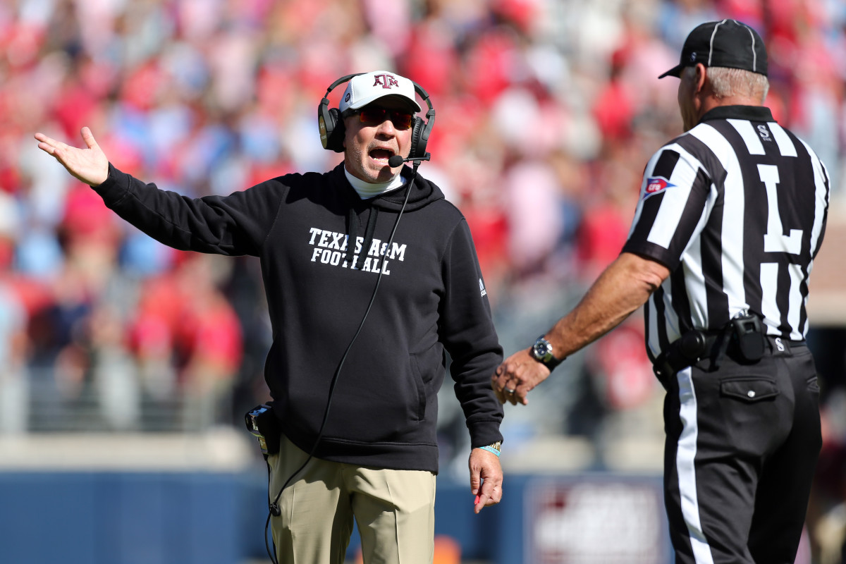 Texas A&M Aggies coach Jimbo Fisher argues with an official during the loss to Ole Miss on Saturday