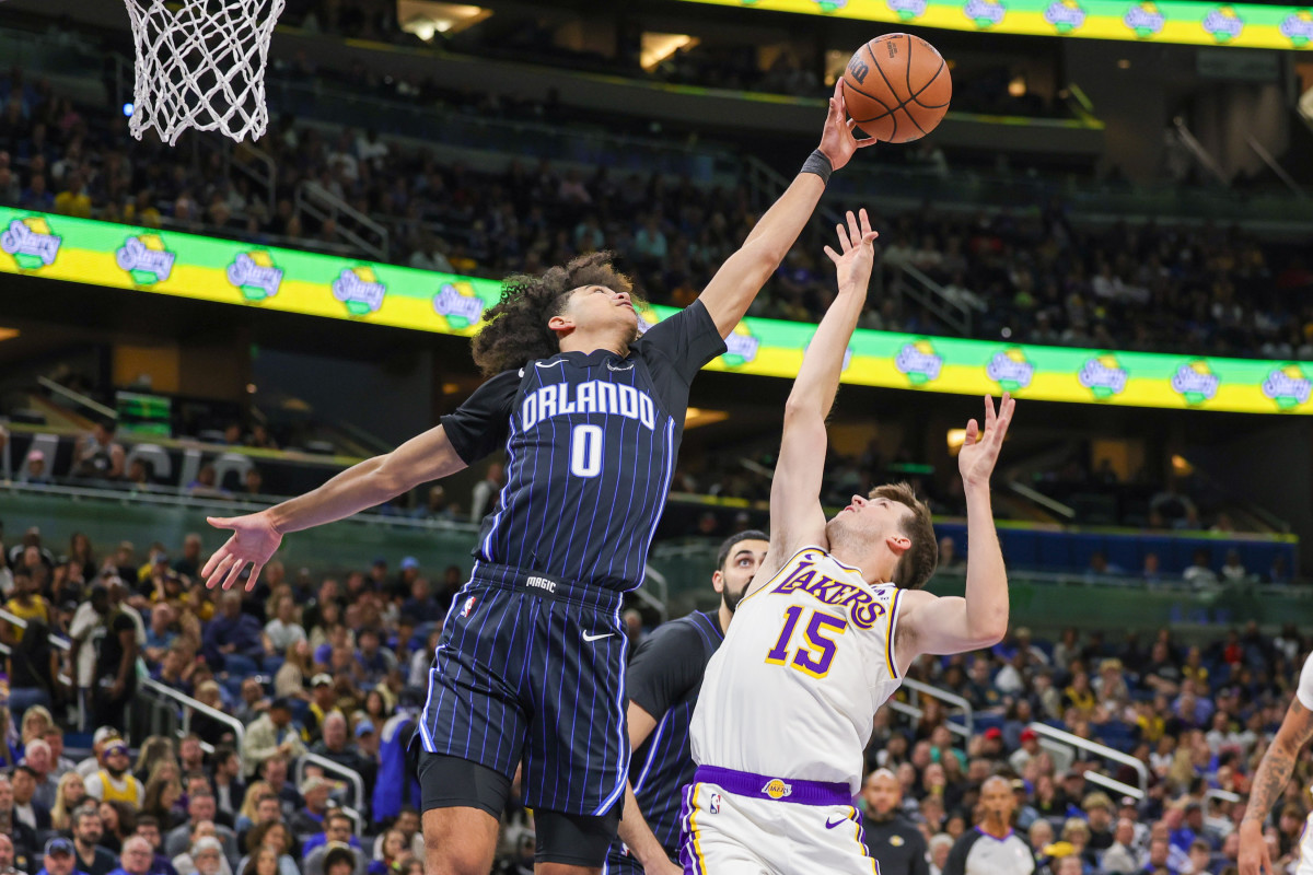 Orlando Magic guard Anthony Black (0) blocks a floater by Los Angeles Lakers guard Austin Reaves (15)