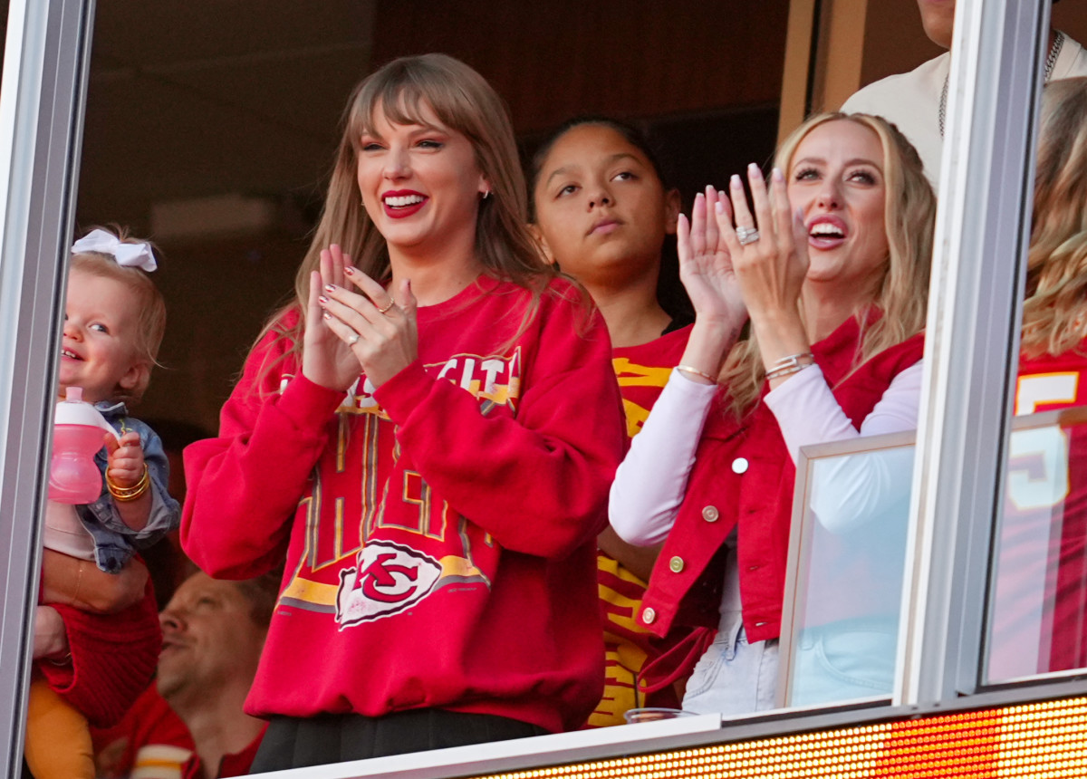Taylor Swift and Brittany Mahomes cheer during the second half between the Los Angeles Chargers and the Kansas City Chiefs at GEHA Field at Arrowhead Stadium.