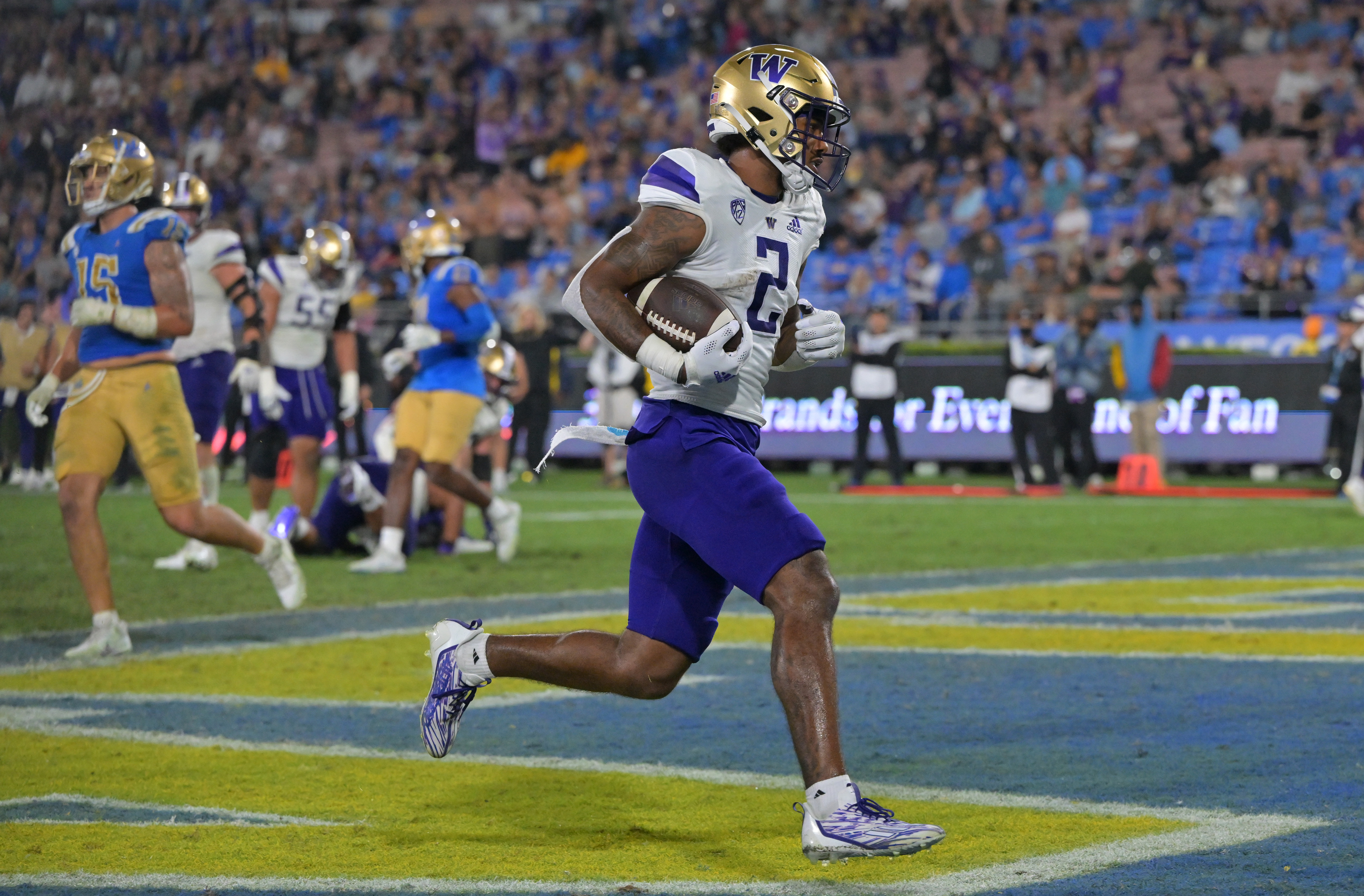 Sep 30, 2022; Pasadena, California, USA; Washington Huskies wide receiver Ja'Lynn Polk (2) runs into the end zone for a touchdown in the second half against the UCLA Bruins at the Rose Bowl. Mandatory Credit: Jayne Kamin-Oncea-USA TODAY Sports