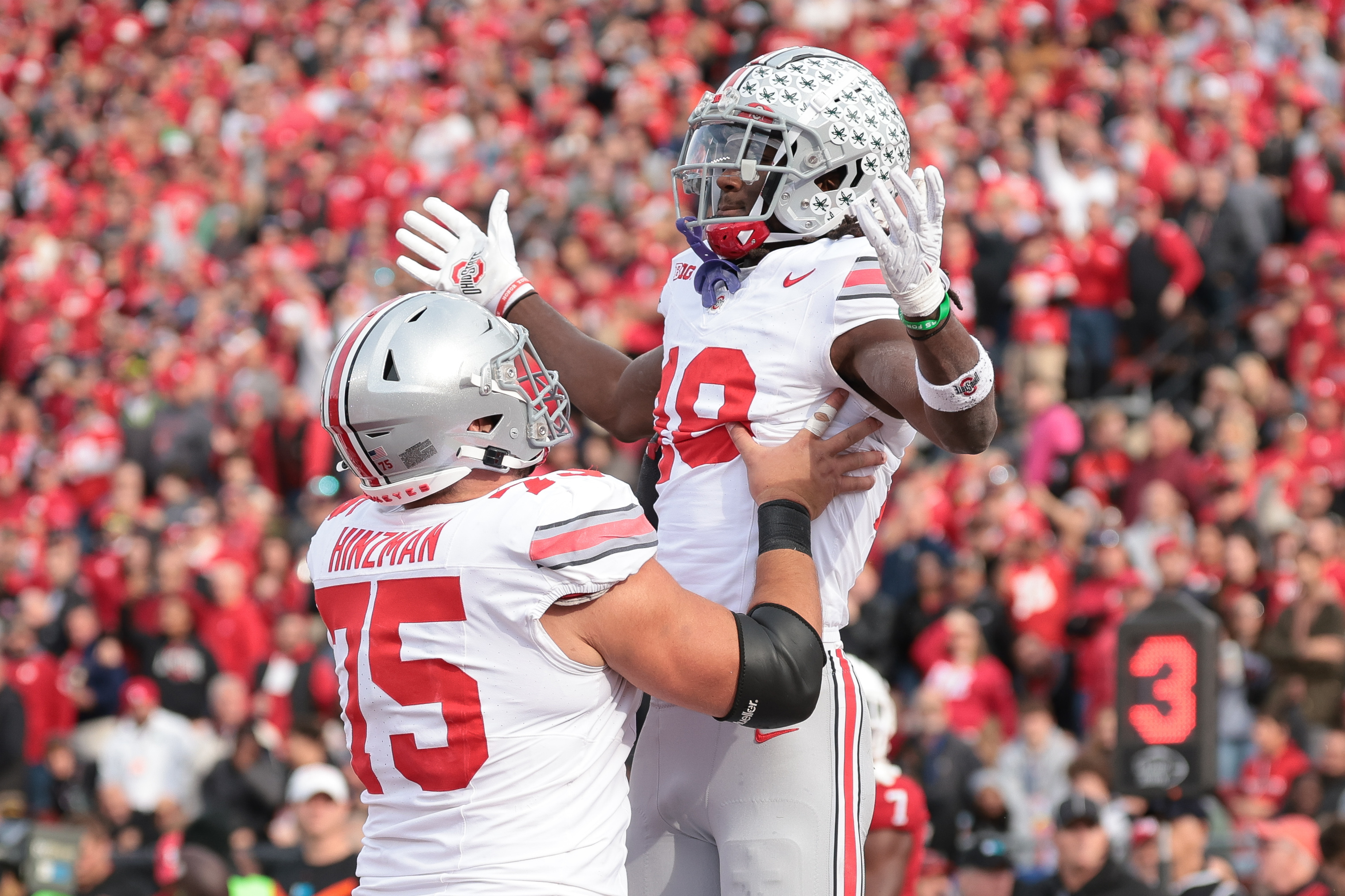 Nov 4, 2023; Piscataway, New Jersey, USA; Ohio State Buckeyes wide receiver Marvin Harrison Jr. (18) celebrates with offensive lineman Carson Hinzman (75) after scoring a touchdown against the Rutgers Scarlet Knights during the second half at SHI Stadium. Mandatory Credit: Vincent Carchietta-USA TODAY Sports