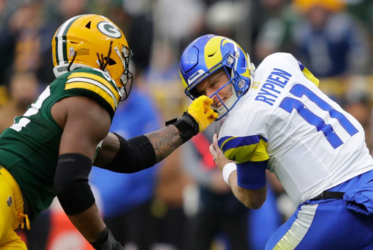 Rypien's facemask gets grabbed early in Los Angeles' loss.