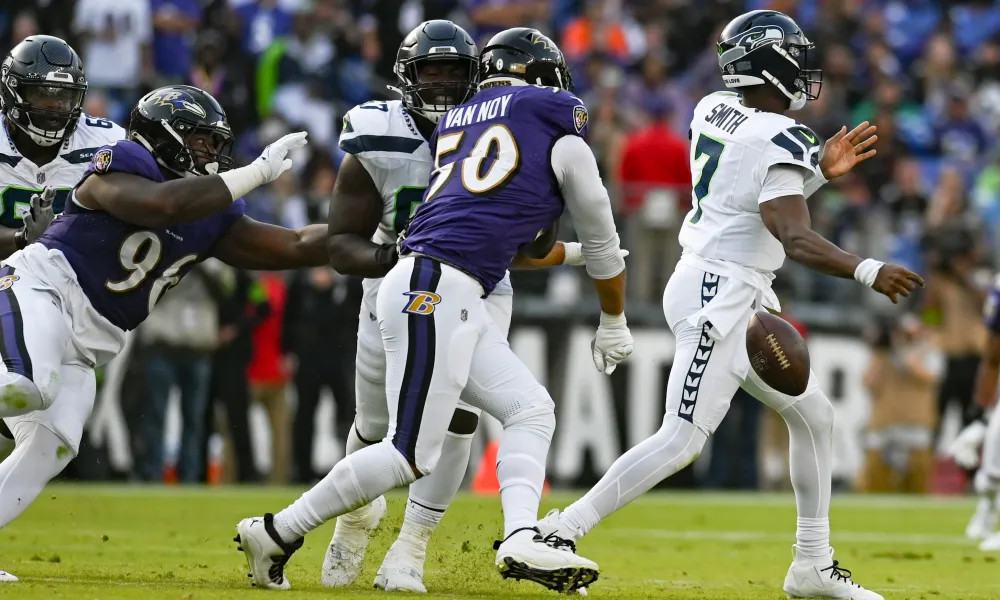 Smith fumbles after a sack by Ravens linebacker Kyle Van Noy.