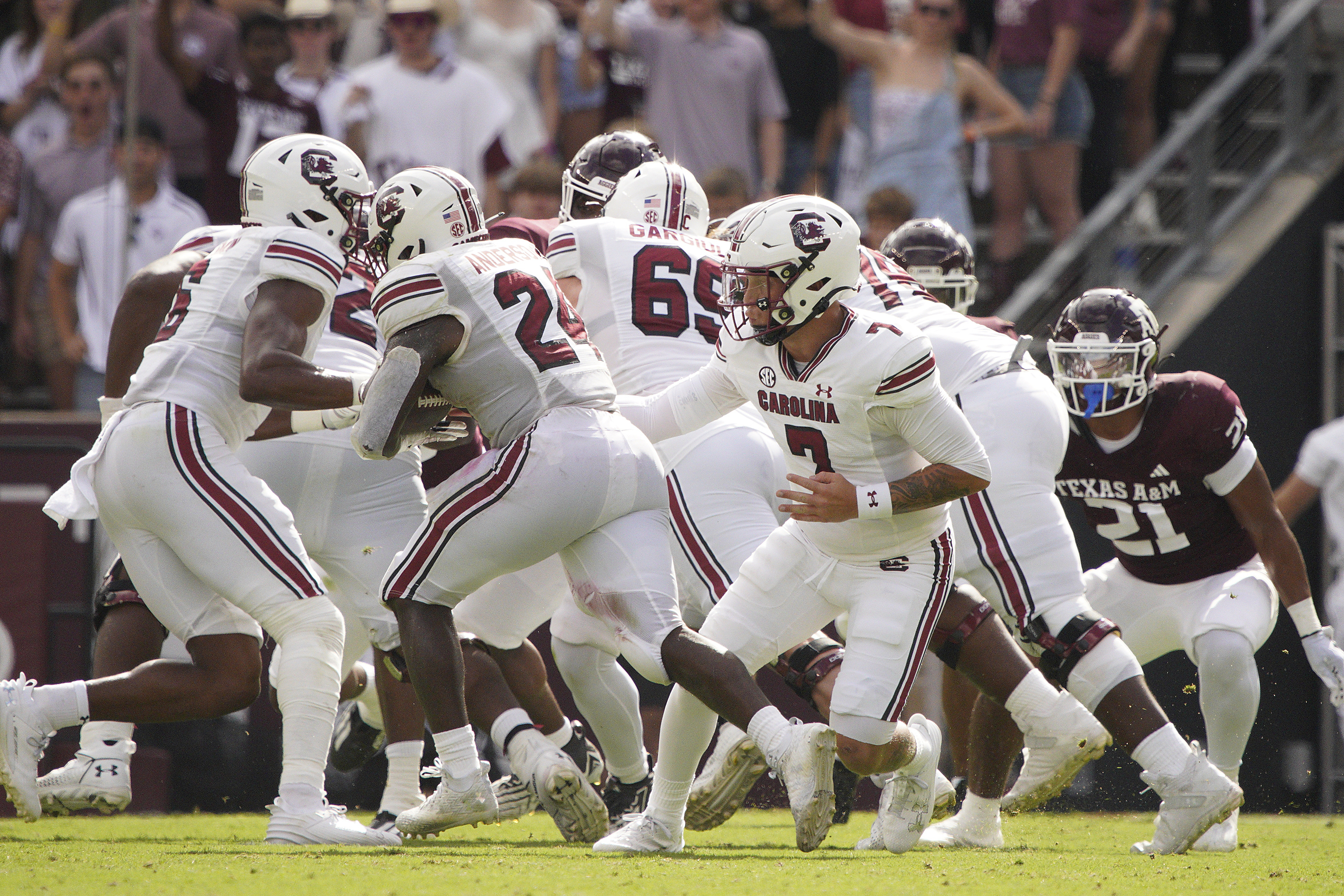 Oct 28, 2023; College Station, Texas, USA; South Carolina Gamecocks quarterback Spencer Rattler (7) hands the ball off to running back Mario Anderson (24) during the first quarter against the South Carolina Gamecocks at Kyle Field. Mandatory Credit: Dustin Safranek-USA TODAY Sports