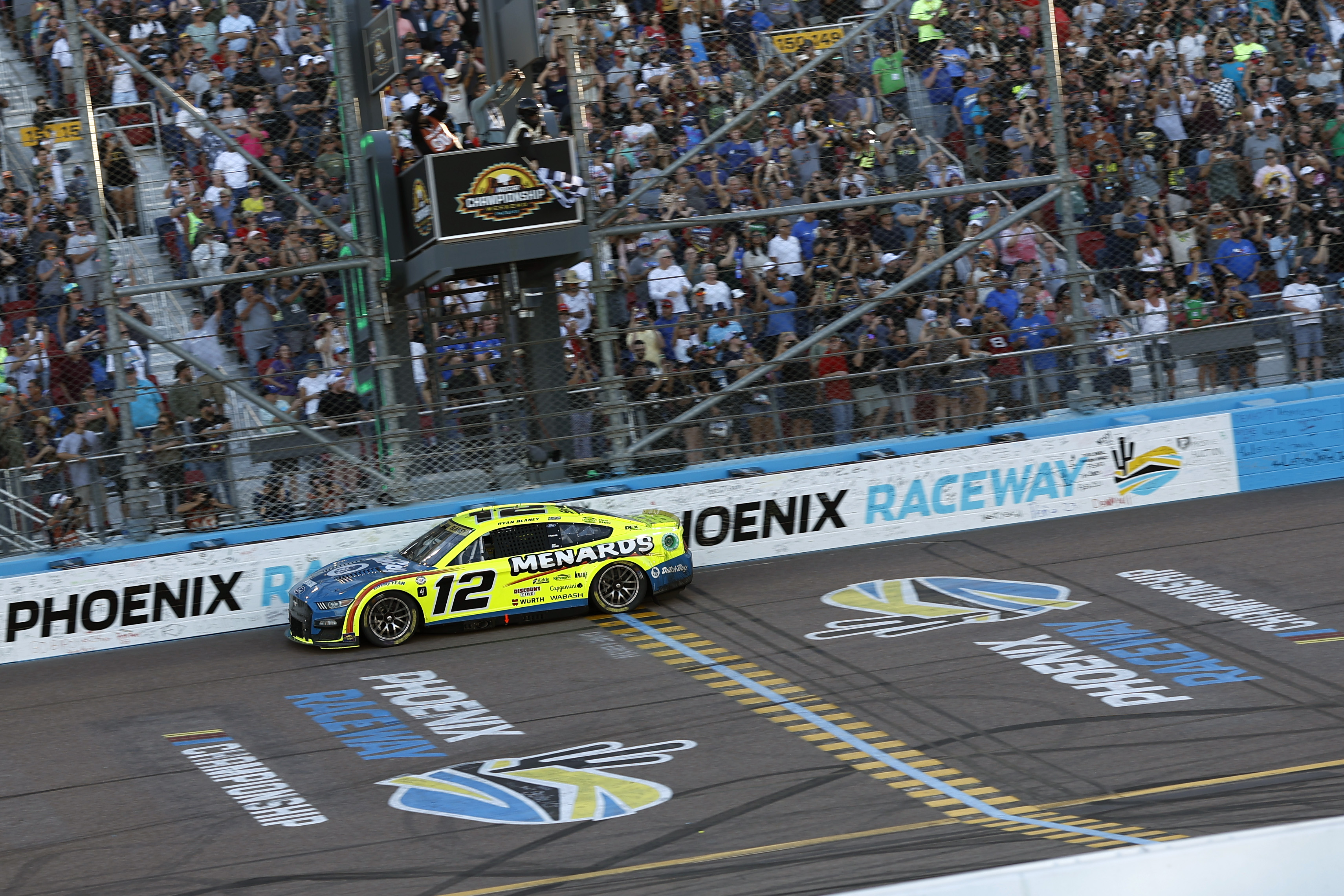 Ryan Blaney crosses the finish line to win the 2023 NASCAR Cup Series Championship, finishing first of the Championship 4 drivers Sunday at Phoenix Raceway. (Photo by Chris Graythen/Getty Images)
