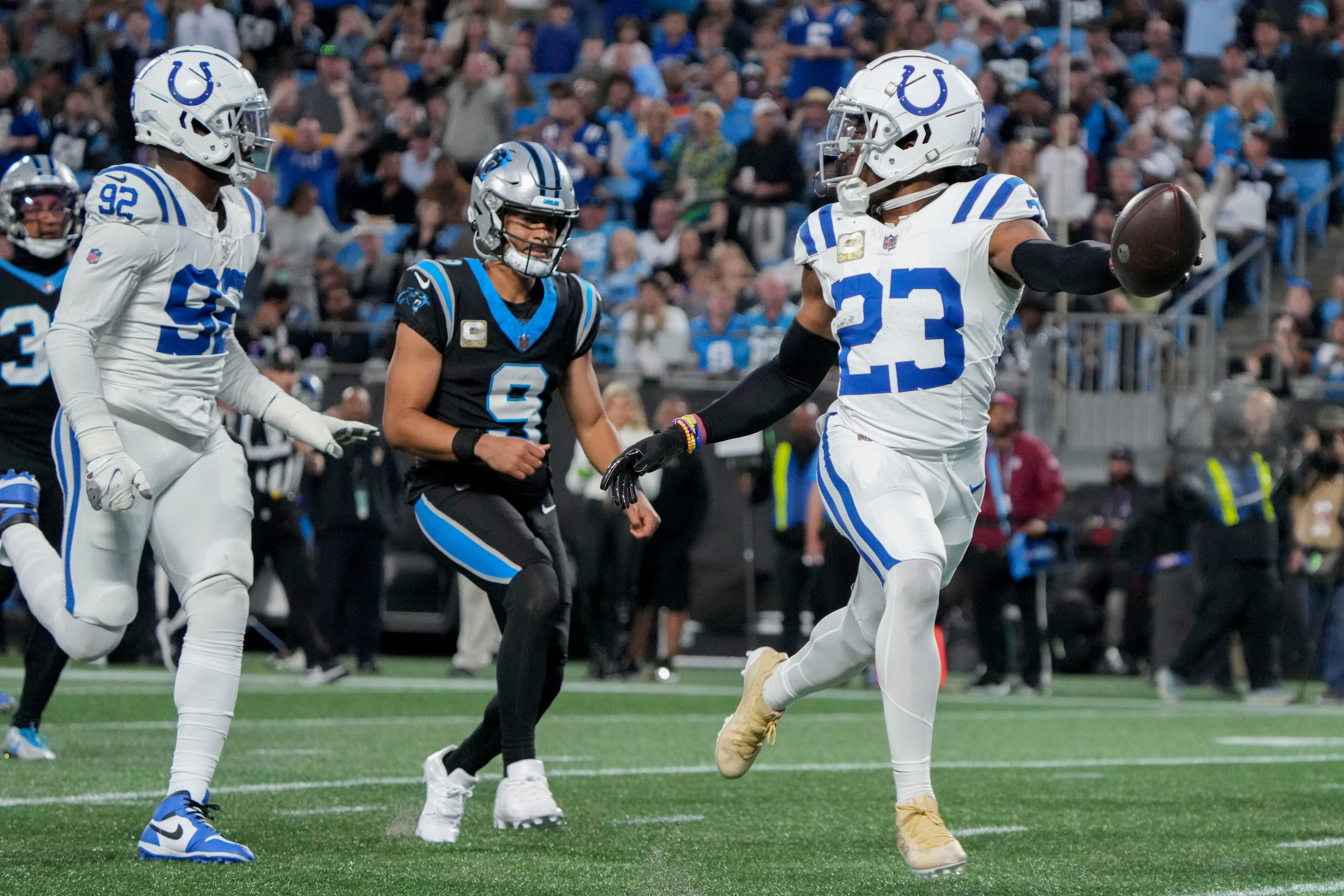 Indianapolis Colts cornerback Kenny Moore II (23) runs 49 yards for a touchdown after intercepting a pass by Carolina Panthers quarterback Bryce Young (9) on Sunday, Nov. 5, 2023, during a game against the Carolina Panthers at Bank of America Stadium in Charlotte.