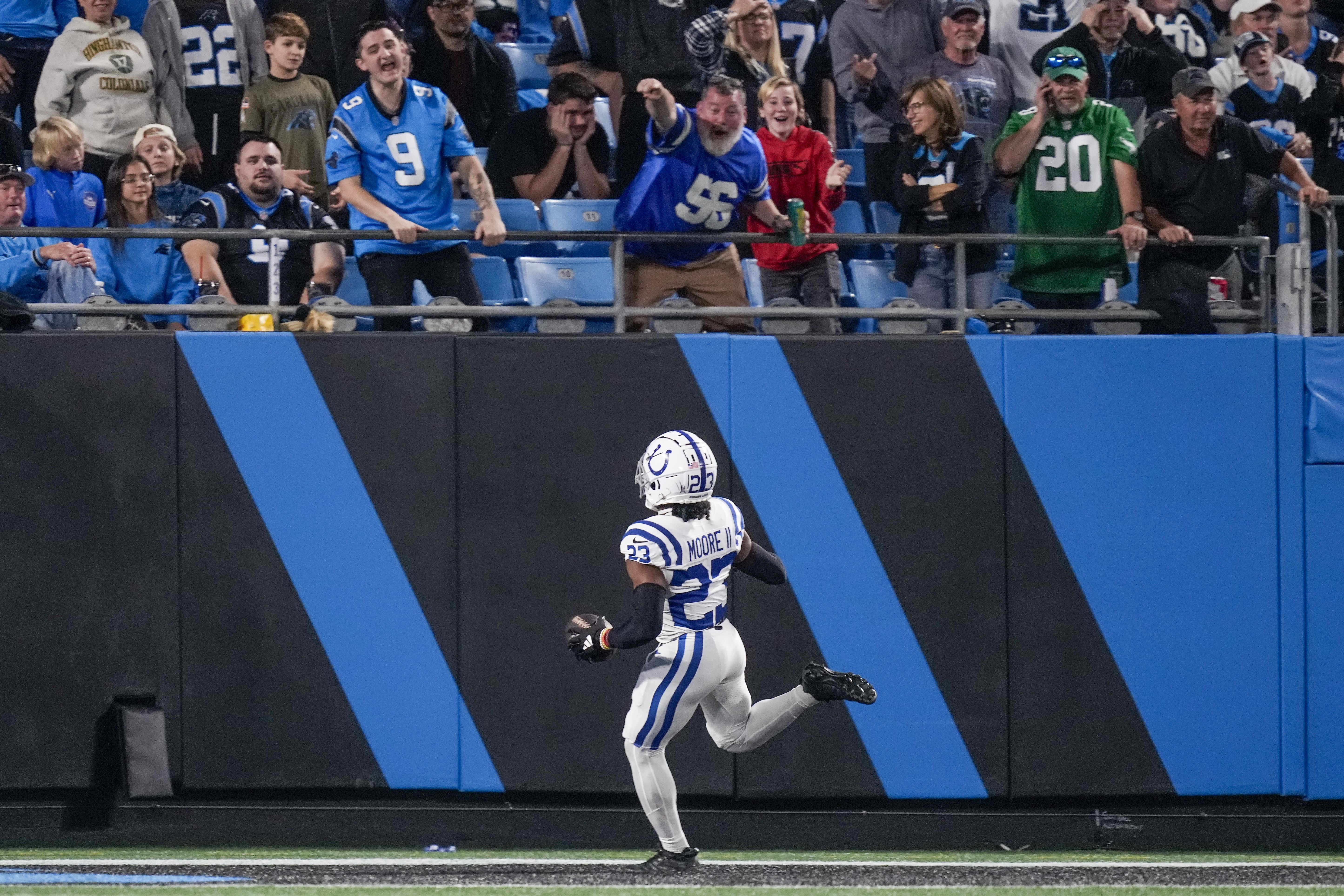 Nov 5, 2023; Charlotte, North Carolina, USA; Indianapolis Colts cornerback Kenny Moore II (23) gets a pick six as fans cheer during the second half against the Carolina Panthers at Bank of America Stadium. Mandatory Credit: Jim Dedmon-USA TODAY Sports