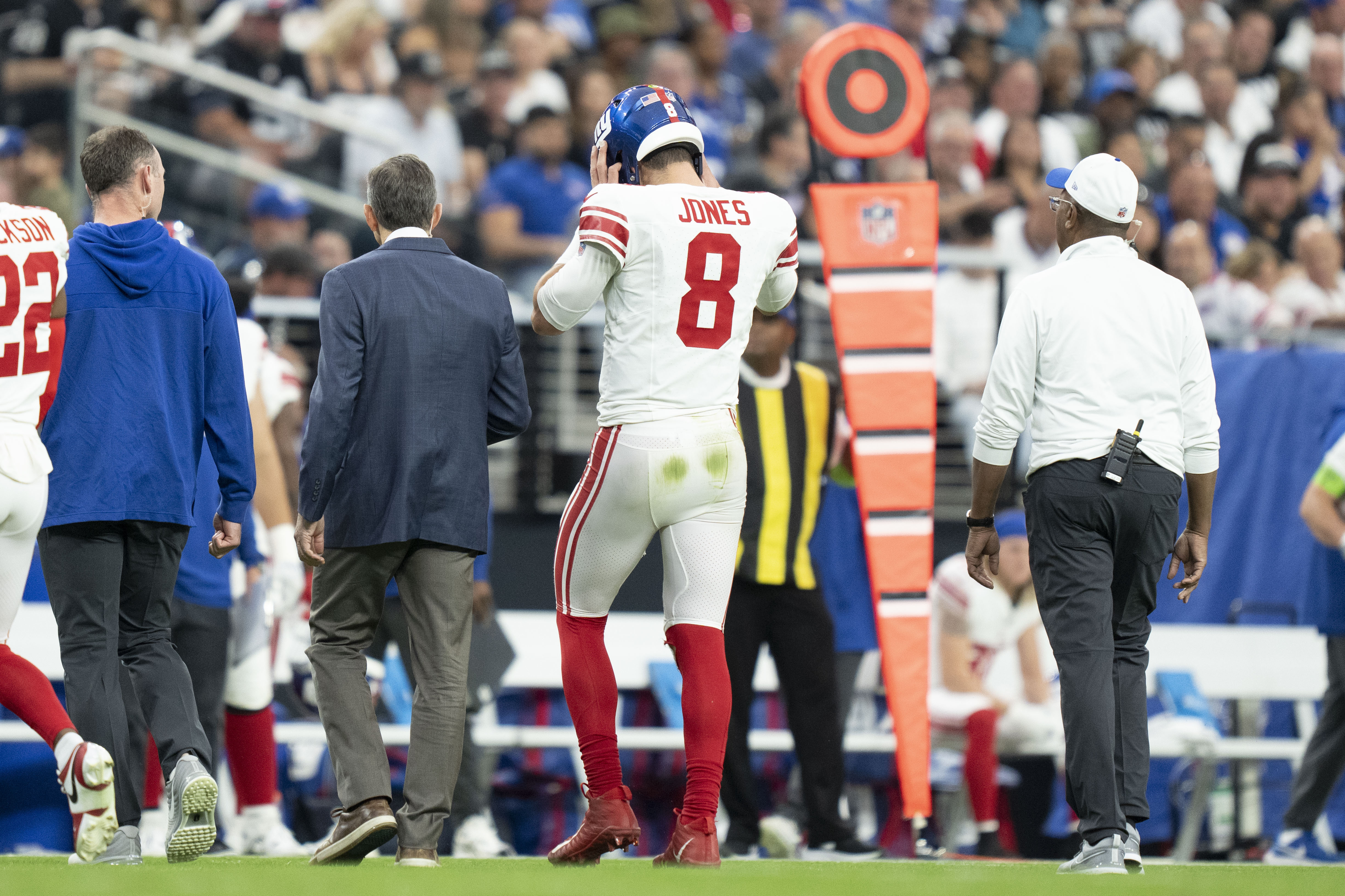 Giants quarterback Daniel Jones walks to the sideline after suffering a torn Achilles against the Raiders during the second quarter Sunday at Allegiant Stadium.