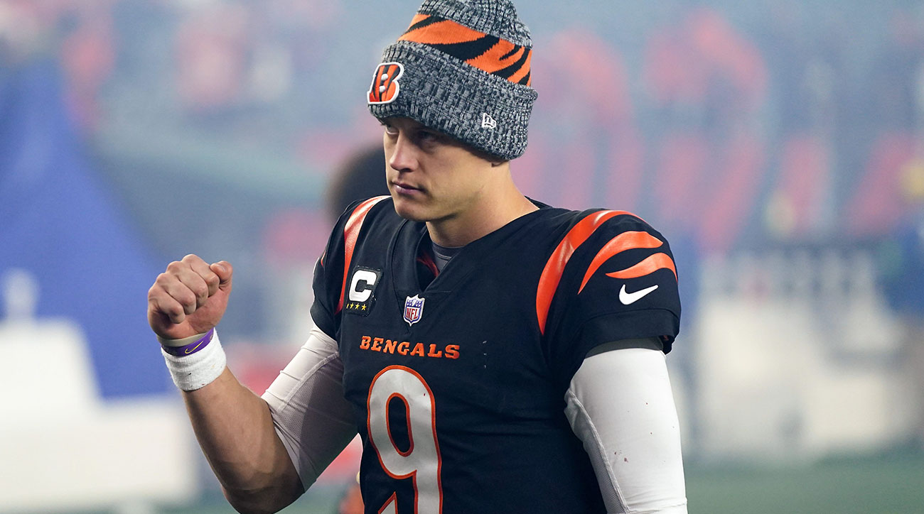 Joe Burrow pumps his fist after the Bengals beat the Bills