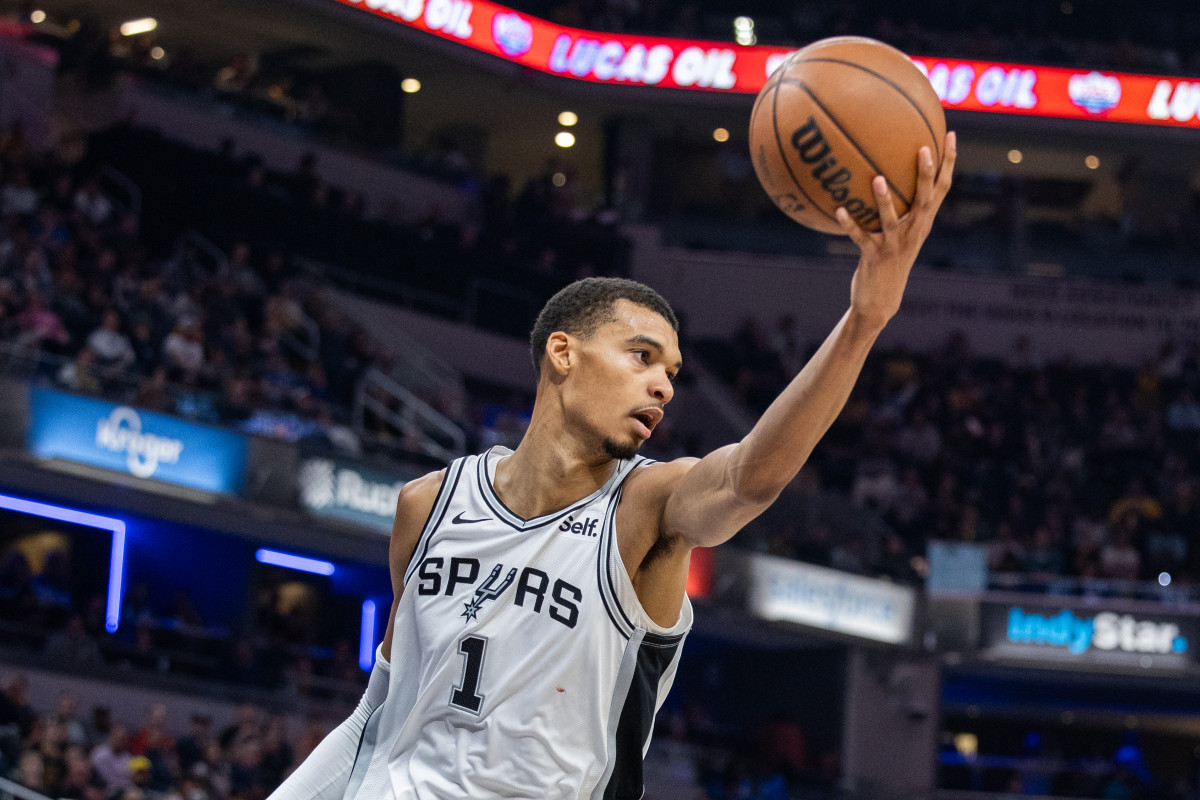 San Antonio Spurs rookie Victor Wembanyama grabs a rebound at Frost Bank Center.