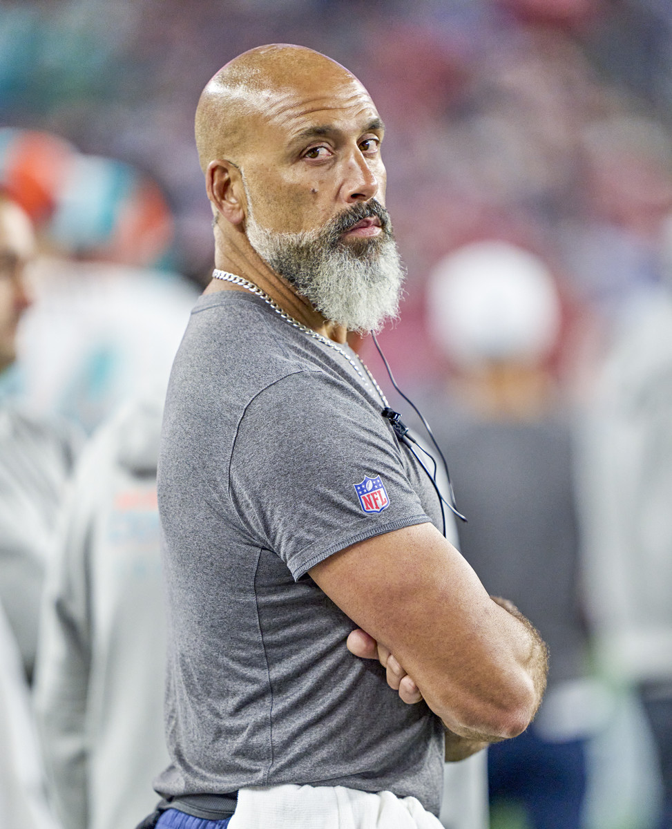 Dolphins assistant equipment manager Charlie Thiele on the sideline during a game.
