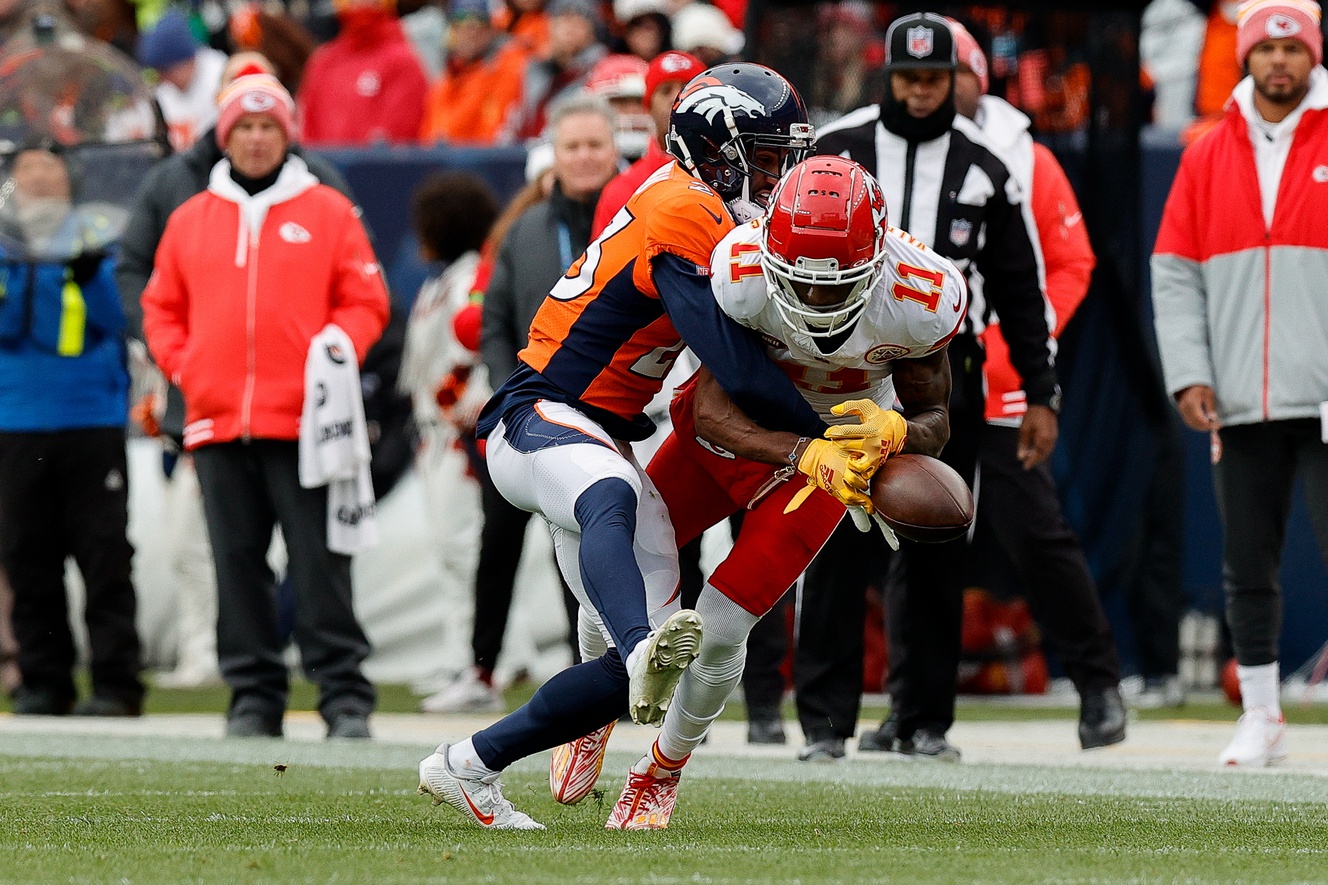 Denver Broncos cornerback Fabian Moreau (23) breaks up a pass intended for Kansas City Chiefs wide receiver Marquez Valdes-Scantling (11) in the second quarter at Empower Field at Mile High.