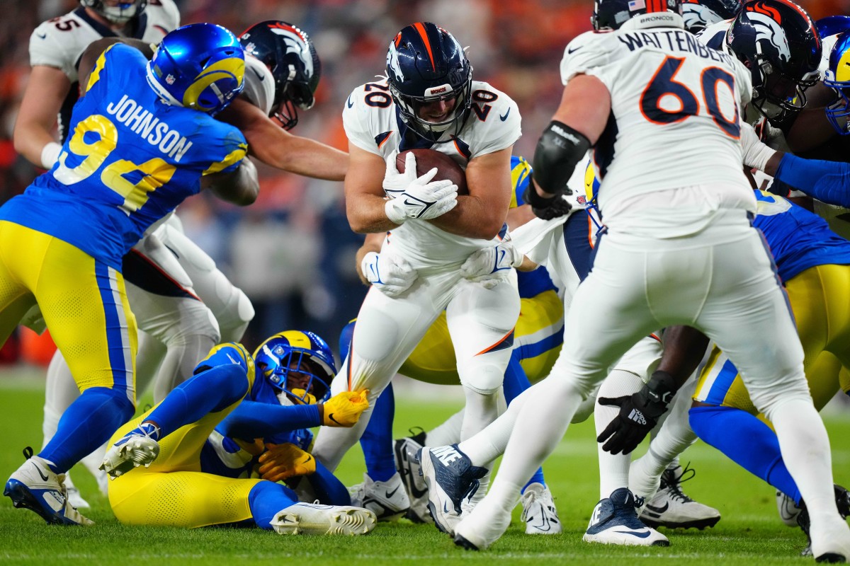 Denver Broncos fullback Michael Burton (20) carries the ball in the first half against the Los Angeles Rams at Empower Field at Mile High.
