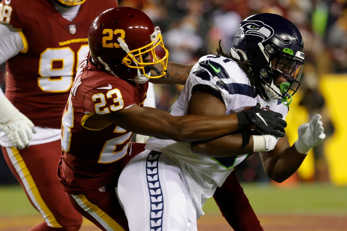 Washington cornerback William Jackson III (23) tackles Seattle Seahawks running back DeeJay Dallas (31) at FedExField.
