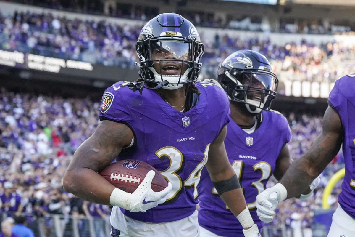 Nov 5, 2023; Baltimore, Maryland, USA; Baltimore Ravens running back Keaton Mitchell (34) celebrates his touchdown against the Seattle Seahawks during the third quarter at M&T Bank Stadium.