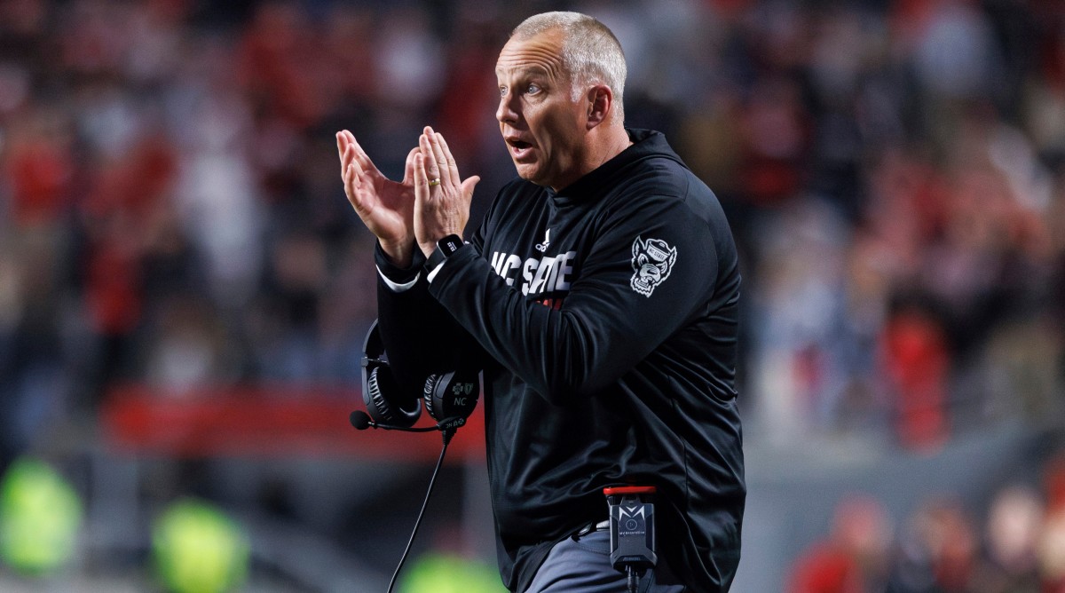 North Carolina State head coach Dave Doeren claps for his team during the second half of a game against Miami.