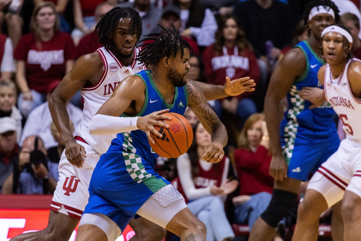 Florida Gulf Coast Eagles forward Zach Anderson (10) dribbles against Indiana Hoosiers forward Mackenzie Mgbako (21) in the first half at Simon Skjodt Assembly Hall.