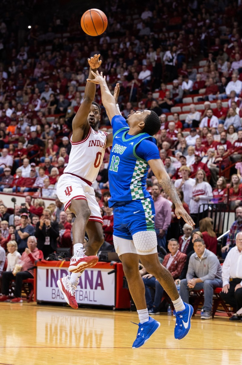 Indiana Hoosiers guard Xavier Johnson (0) shoots against Florida Gulf Coast Eagles guard Franco Miller Jr. (12) in the first half at Simon Skjodt Assembly Hall.