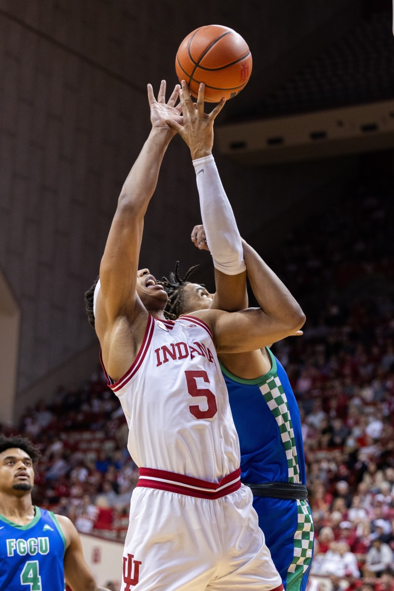 Indiana Hoosiers guard Xavier Johnson (0) shoots against Florida Gulf Coast Eagles guard Franco Miller Jr. (12) in the first half at Simon Skjodt Assembly Hall.