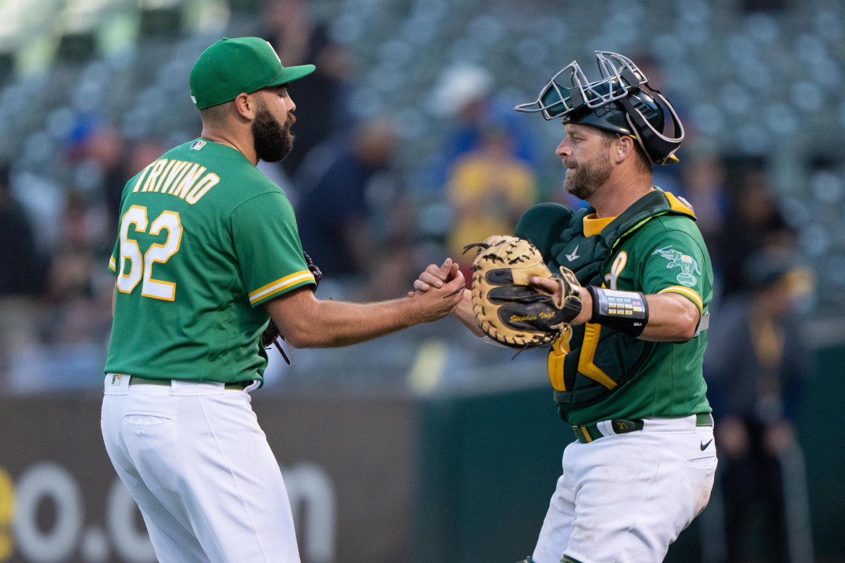 Jul 21, 2022; Oakland, California, USA; Oakland Athletics relief pitcher Lou Trivino (62) celebrates with catcher Stephen Vogt (21) after defeating the Detroit Tigers at RingCentral Coliseum.