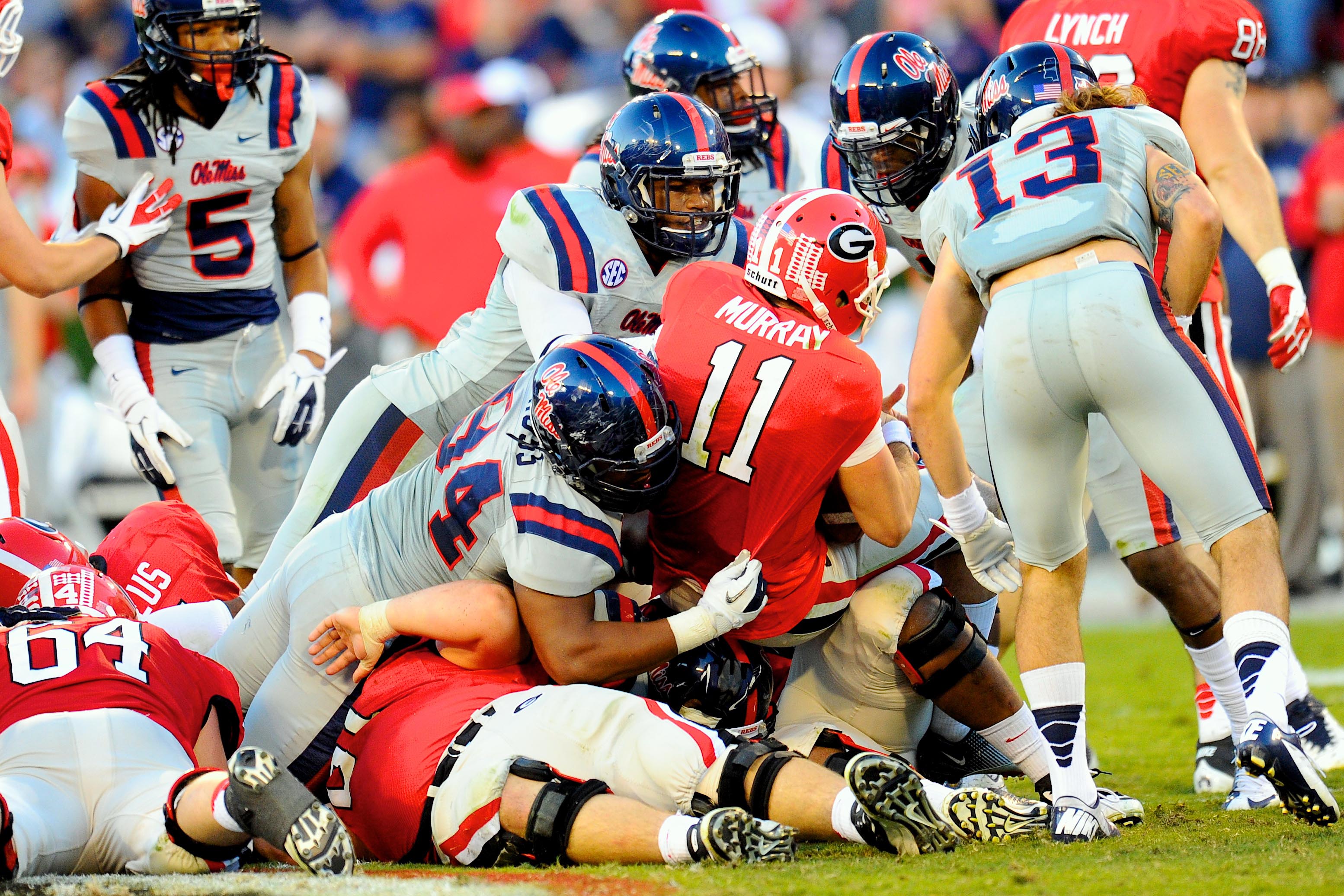 November 3, 2012; Athens, GA, USA; Georgia Bulldogs quarterback Aaron Murray (11) is sacked by Mississippi Rebels defensive lineman Issac Gross (94) during the fourth quarter at Sanford Stadium. Georgia defeated Mississippi 37-10. Mandatory Credit: Dale Zanine-USA TODAY Sports