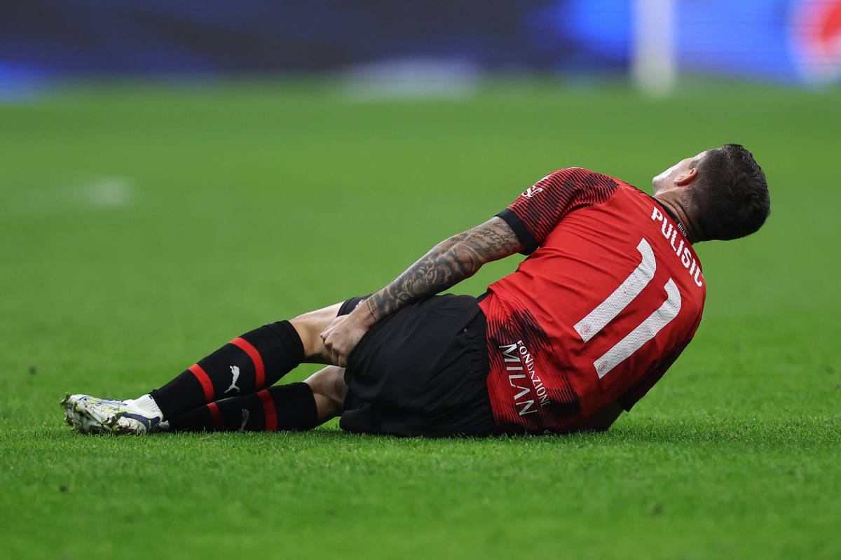 Christian Pulisic pictured holding his left hamstring after suffering an injury blow during AC Milan's 2-1 win over PSG in November 2023