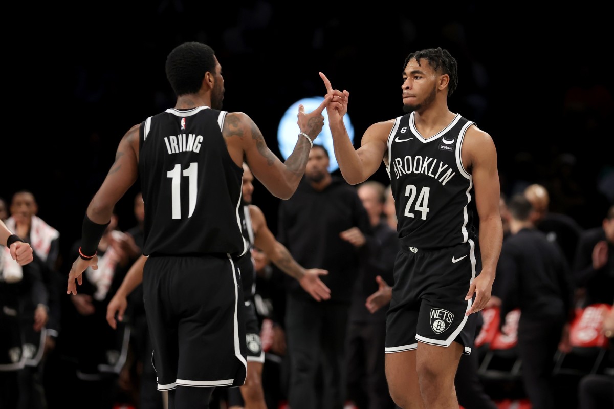  Brooklyn Nets guards Kyrie Irving (11) and Cam Thomas (24) celebrate during the fourth quarter against the Los Angeles Lakers 