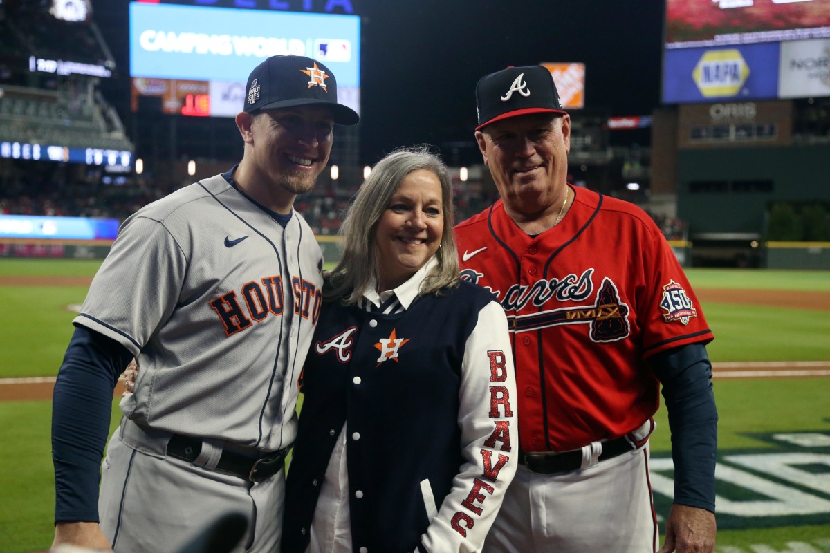 Oct 29, 2021; Atlanta, Georgia, USA; Atlanta Braves manager Brian Snitker (right) and Houston Astros hitting coach Troy Snitker (left) take a photo with Bonnie Snikker prior to game three of the 2021 World Series at Truist Park.