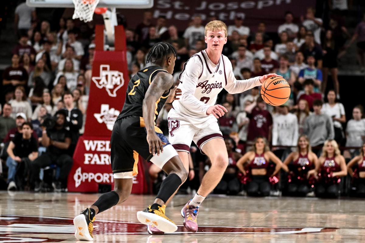 Nov 6, 2023; College Station, Texas, USA; Texas A&M Aggies guard Hayden Hefner (2) dribbles the ball as Texas A&M Commerce guard Kalen Williams (2) defends in the second half at Reed Arena.