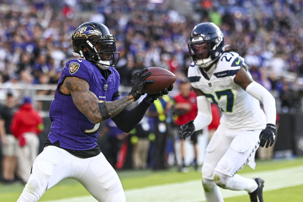 Baltimore Ravens wide receiver Odell Beckham Jr. (3) catches a pass for a touchdown in front of Seattle Seahawks cornerback Riq Woolen (27) during the fourth quarter at M&T Bank Stadium.