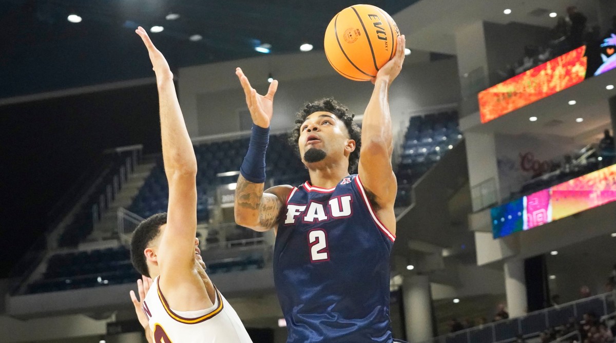 Florida Atlantic guard Nicholas Boyd (2) shoots over Loyola Chicago guard Jalen Quinn (2) during the second half of a game.