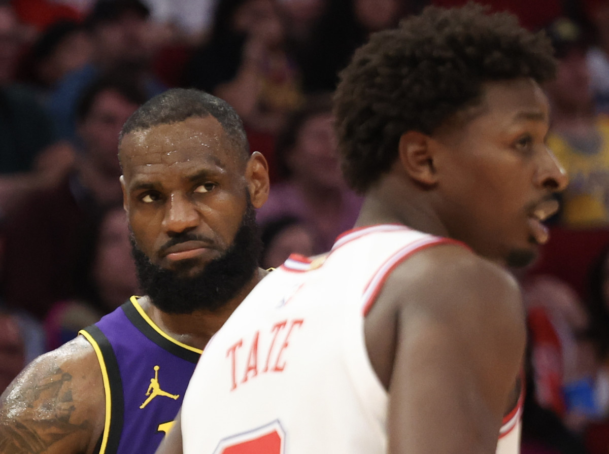 Los Angeles Lakers forward LeBron James (23) reacts to playing against the Houston Rockets forward Jae'Sean Tate (8) in the second half at Toyota Center.