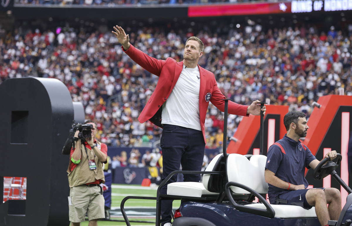 Former Houston Texans player J.J. Watt waves to the crowd after being inducted into the Texans Ring of Honor during the game against the Pittsburgh Steelers at NRG Stadium.